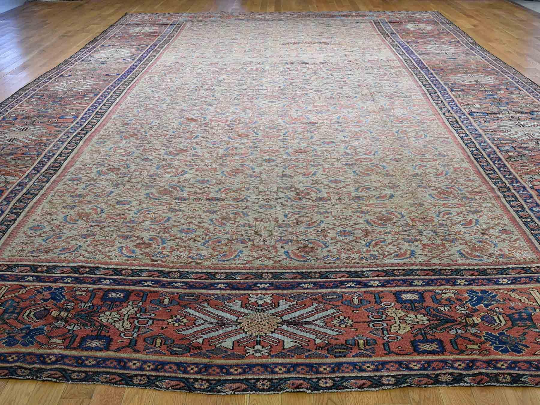 This is a genuine hand knotted oriental rug. It is not hand tufted or machine made rug. Our entire inventory is made of either hand knotted or handwoven rugs.

Enhance your home with this magnificent antique carpet. This handcrafted Persian Mahal
