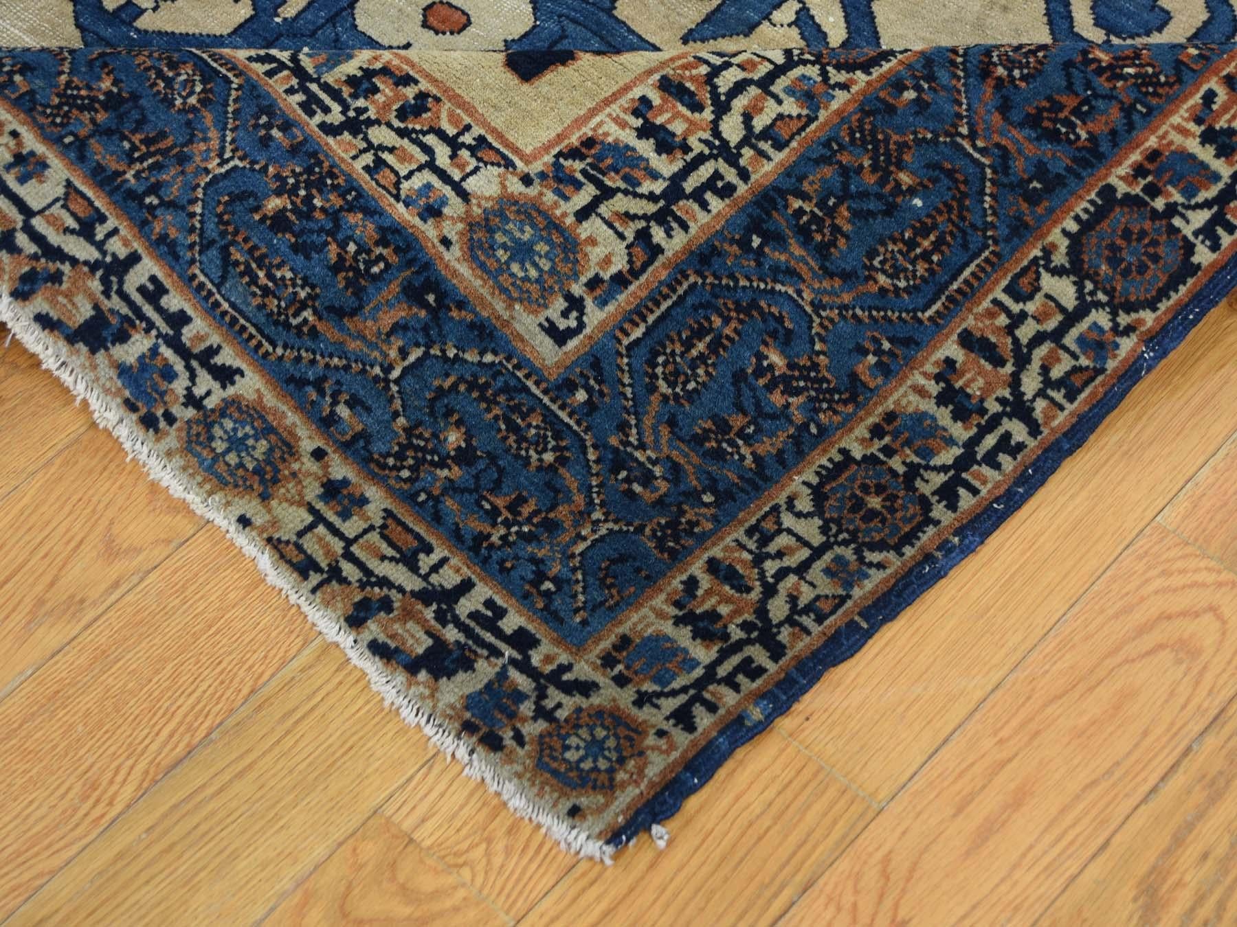 This is a genuine hand knotted oriental rug. It is not hand tufted or machine made rug. Our entire inventory is made of either hand knotted or handwoven rugs.

Bring life to your home with this admirable antique carpet. This handcrafted Persian