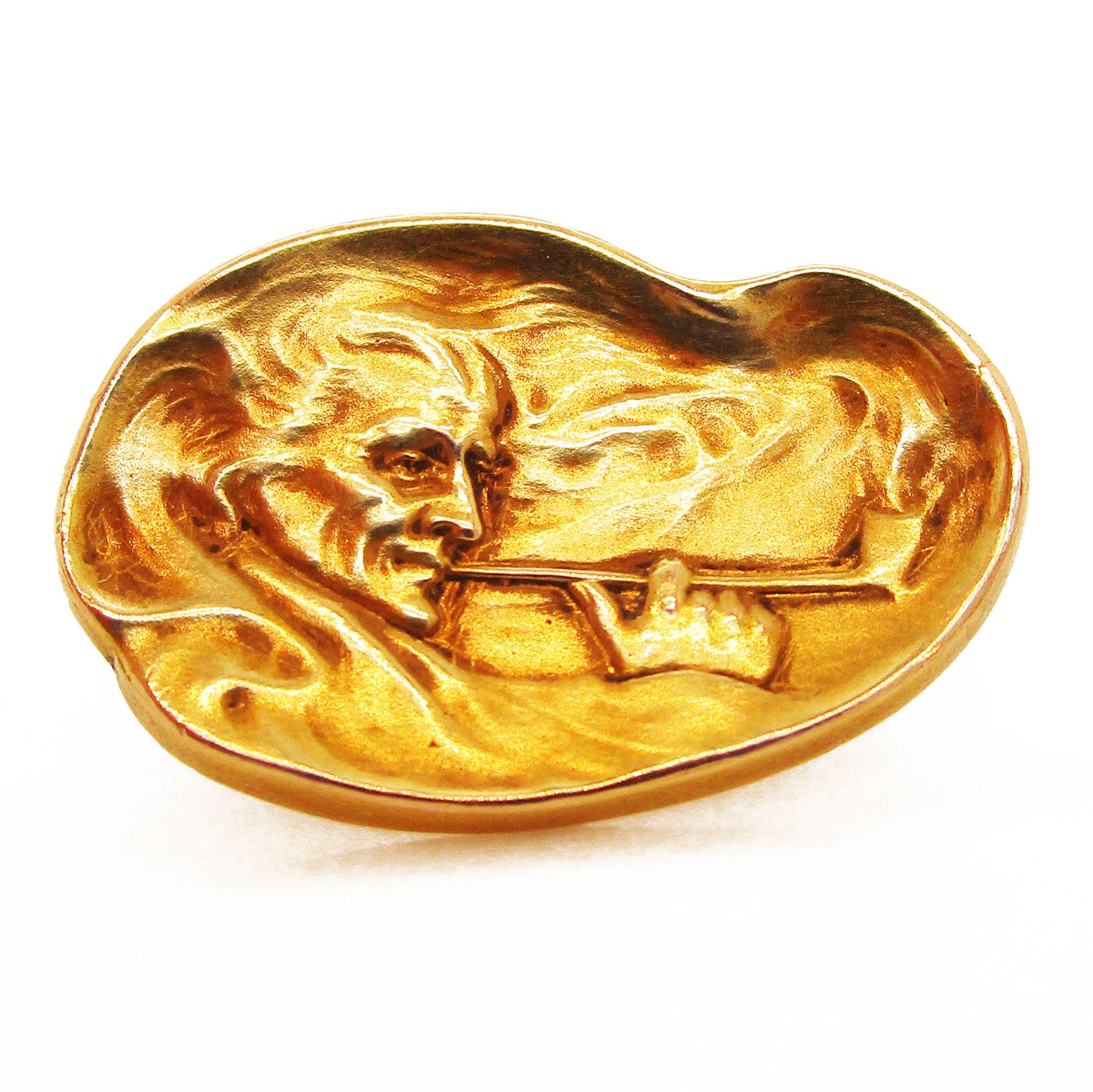 These magnificent Art Nouveau cufflinks date back to 1890 and boast rich 14k yellow gold and an incredibly detailed engraved image of a pipe-smoking man. These links are solid 14 karat yellow gold, lending them an excellent weight and a bright color