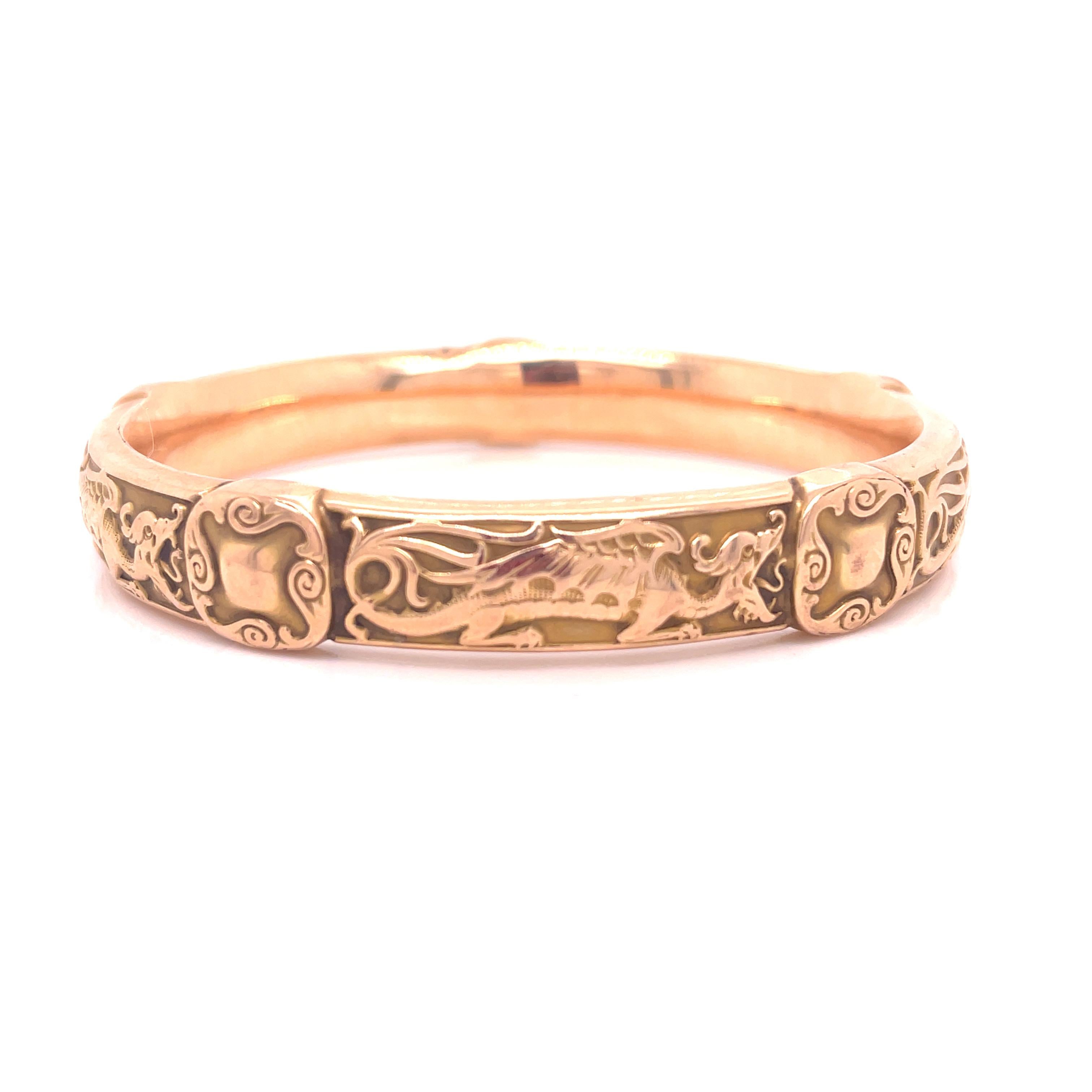 This is a brilliant original 1890 slip on Art Nouveau Riker Brothers bangle set in 14K Rose gold that features an amazing engraved dragon design. This bangle measures 7.25