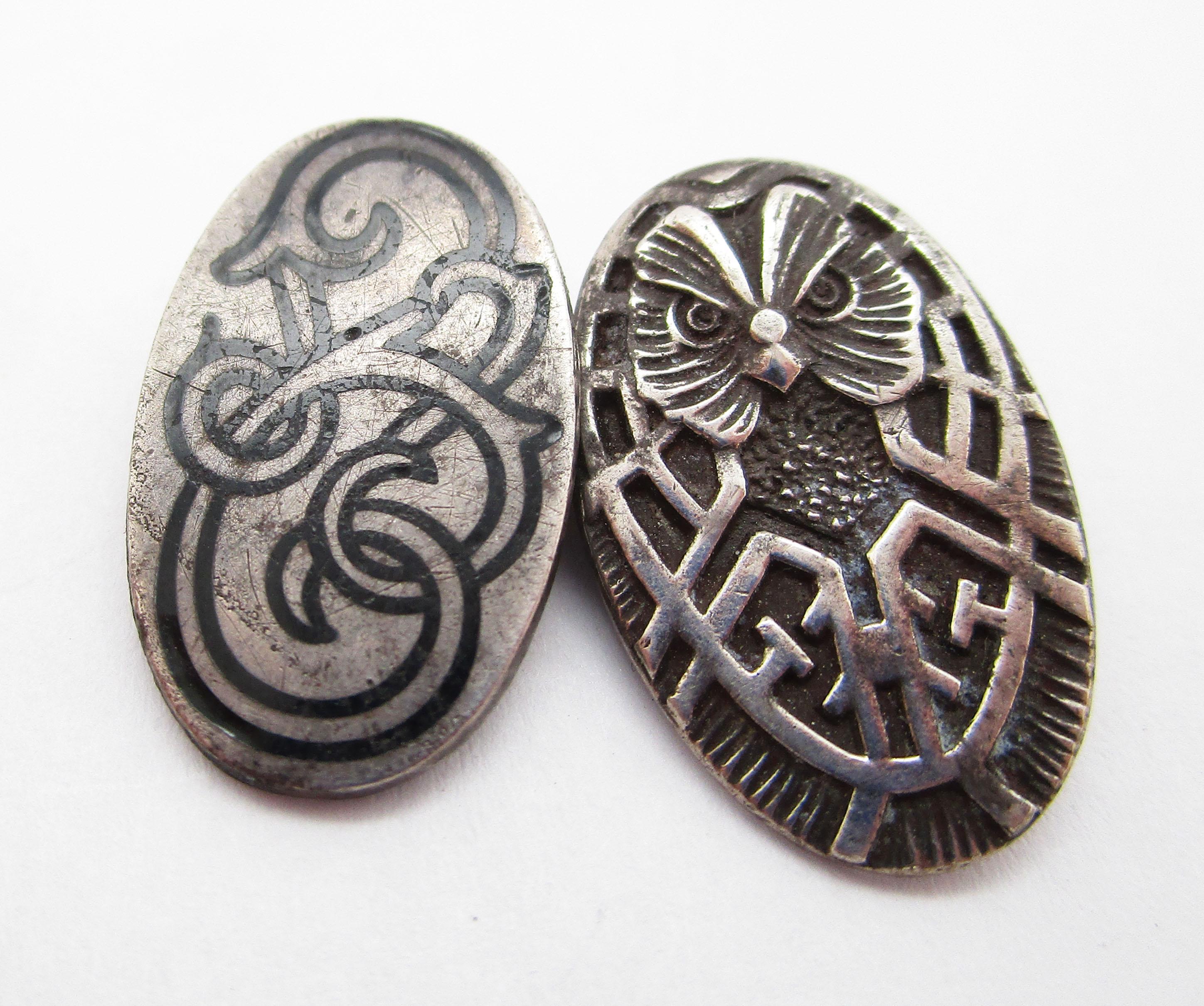 These incredible Art Nouveau cufflinks by the Unger Brothers are from 1890 and are in sterling silver. They feature a magnificent aesthetic movement design with a majestic wise owl peering out from one side and a dramatic enameled Celtic knot on the