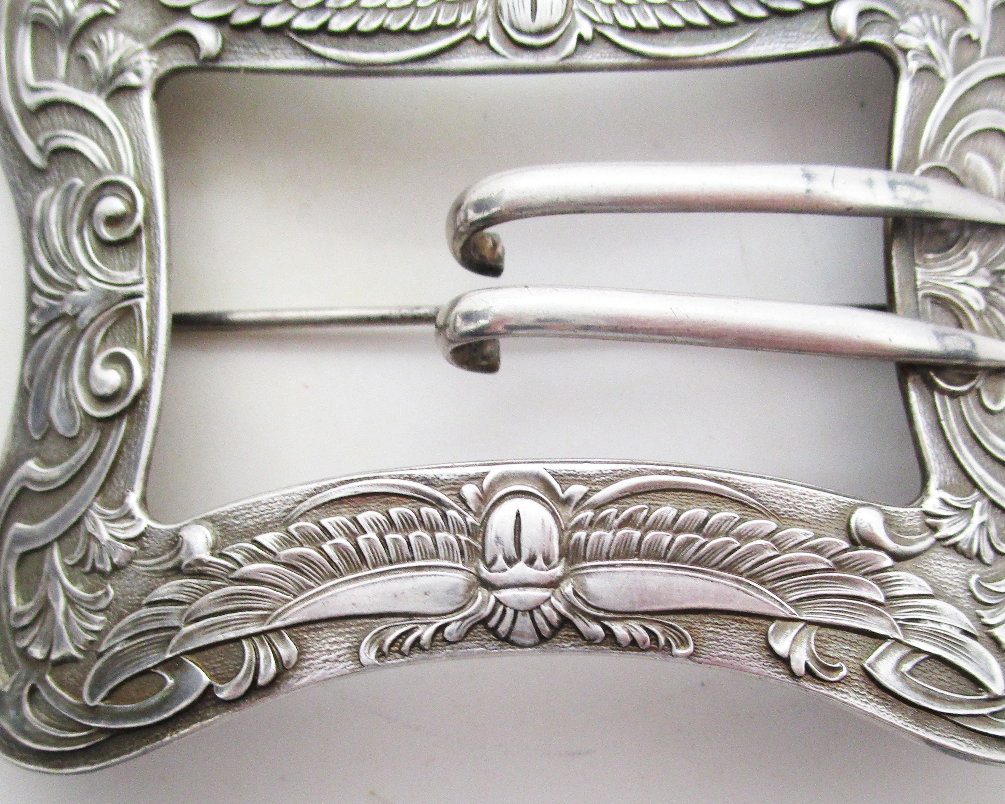 This fantastic Art Nouveau 1st Egyptian Revival style belt buckle brooch is by the Unger Brothers in sterling silver. The dramatic large scale of the brooch is enough to make it a statement piece, but what makes it truly remarkable is the incredible
