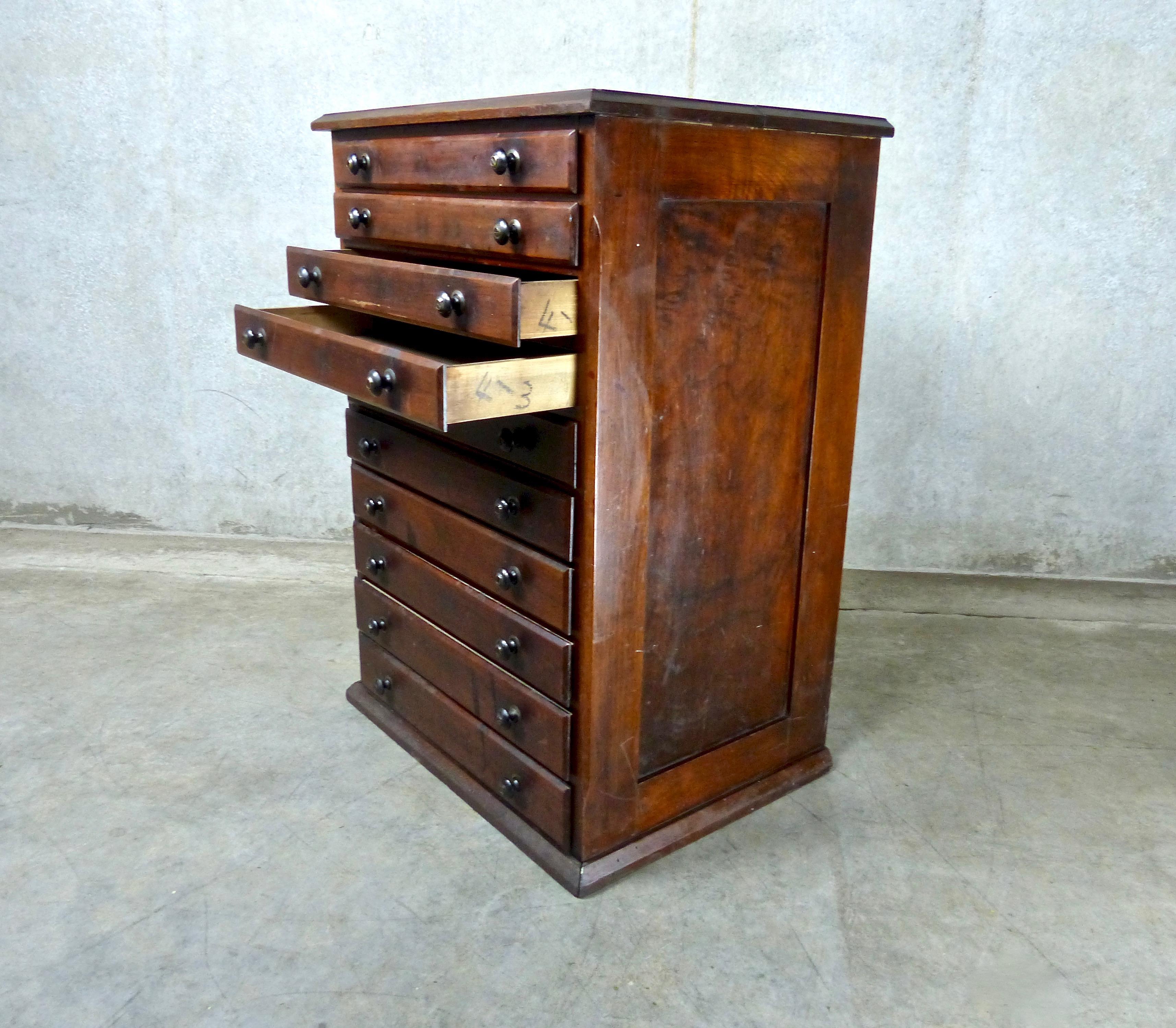 Compact oak dental cabinet with pine secondary woods. Features 10, 2-inch high drawers for art, blueprints, and other fragile small works. Original surfaces and hardware. Dimensions: 31” H x 21.5” W x 16.5” D.