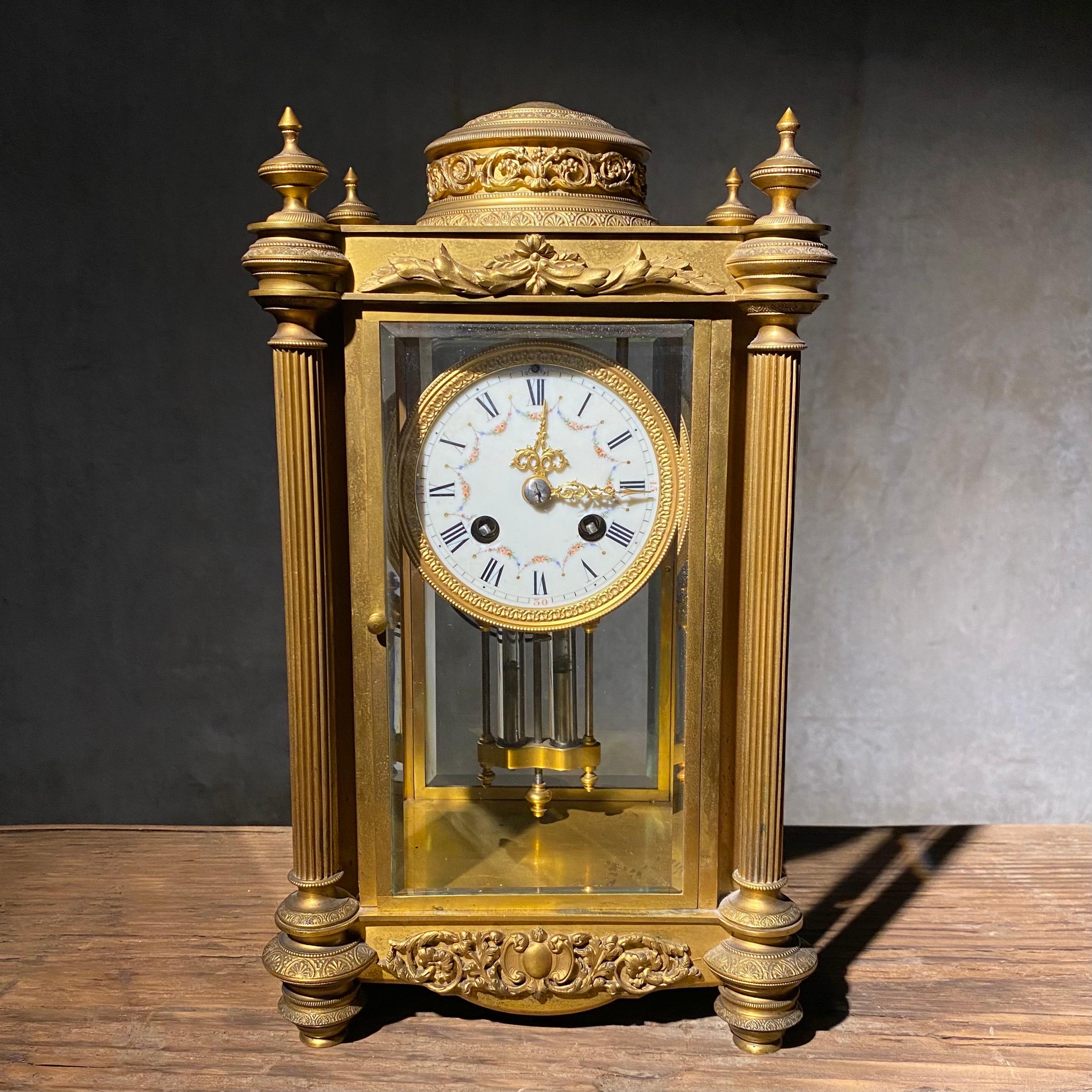 Antique French crystal  mantel clock by Samuel Marti features  bronze frame with reeded columns encasing beveled crystal panels , excellent details sculpted features , enameled copper face with decorated bronze features and works marked S. Marti et