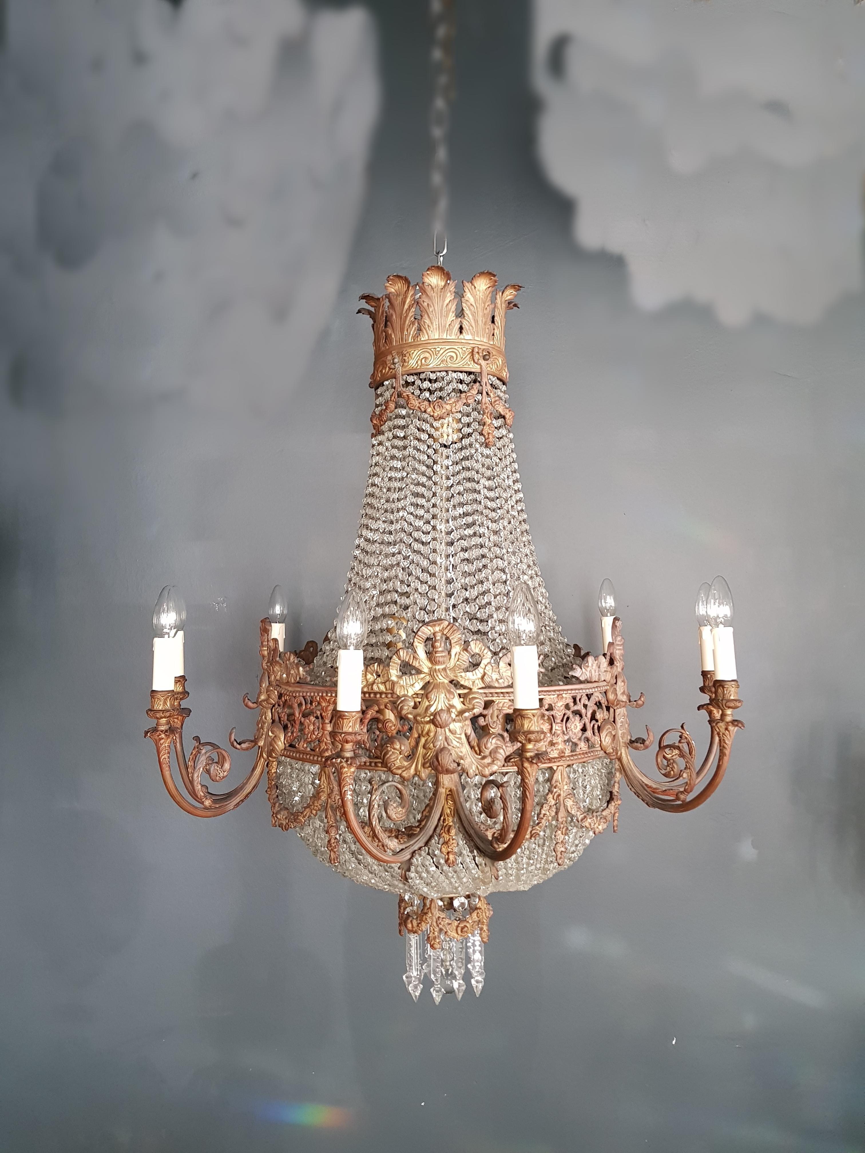 This beaded Empire basket chandelier has 17 lights. All the beads are made of genuine crystal and the drops are made of original Bohemia crystal. Chandelier has been restored but we have maintained the original shape and integrity of the late 19th