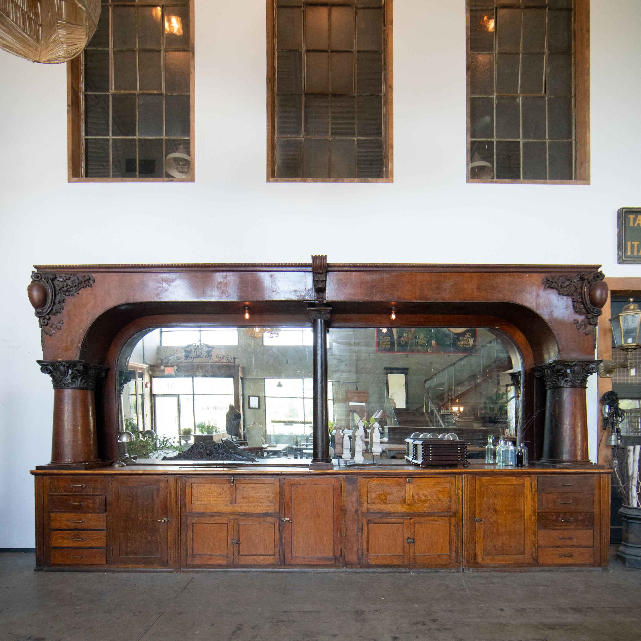 Chicago made Charles Passow and sons Back bar

Impressive, single-arch mahogany back bar, with large back mirrors. Features numerous cabinets and drawers, including two metal-lined cabinets with metal shelves and glass doors. Design elements include