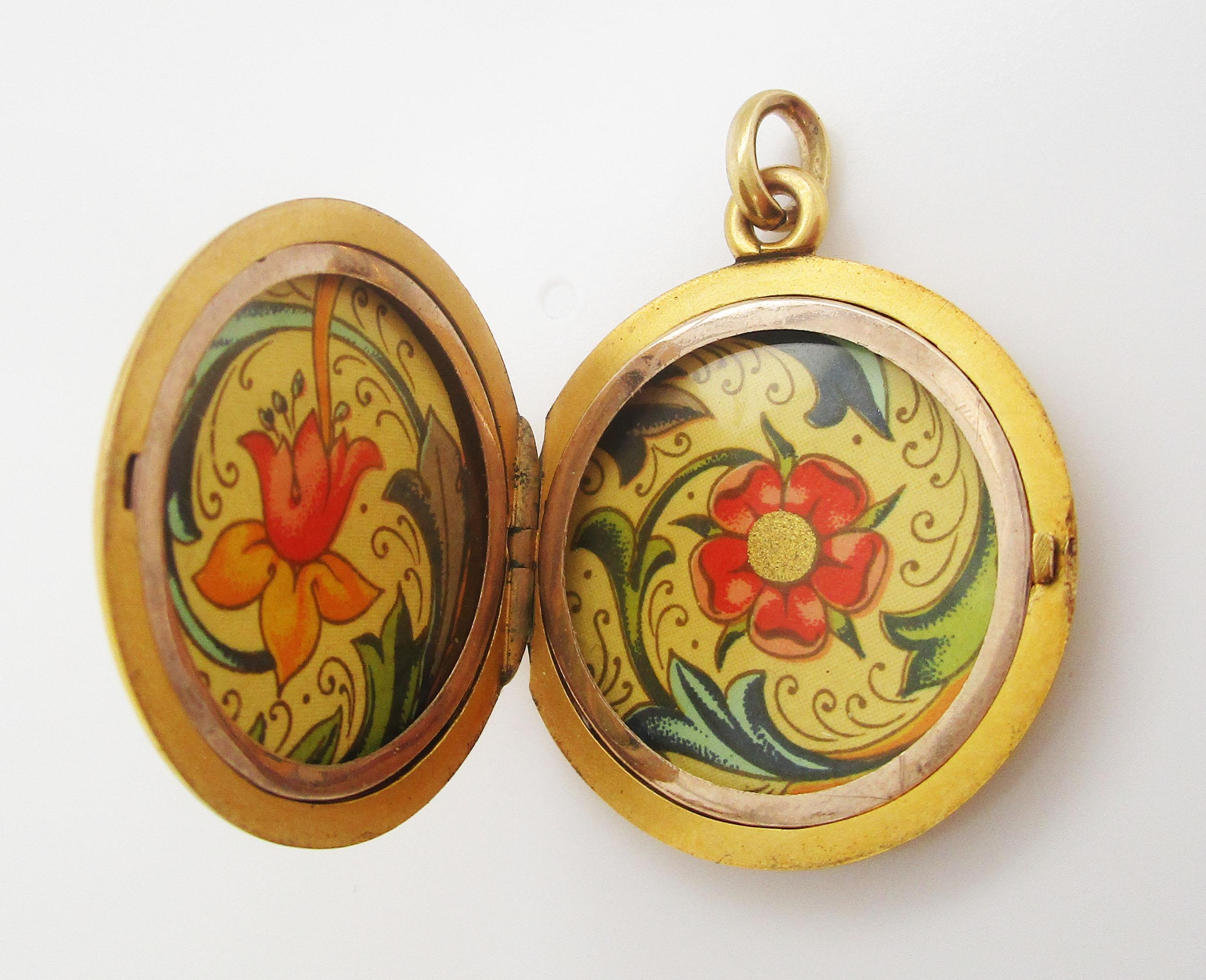 This is a gorgeous Victorian locket with a beautiful high-karat finish. The inside of the locket is decorated with a lovely floral paper. The back of the locket is open to be personalized! The locket is a classic round shape with a sleek, flat