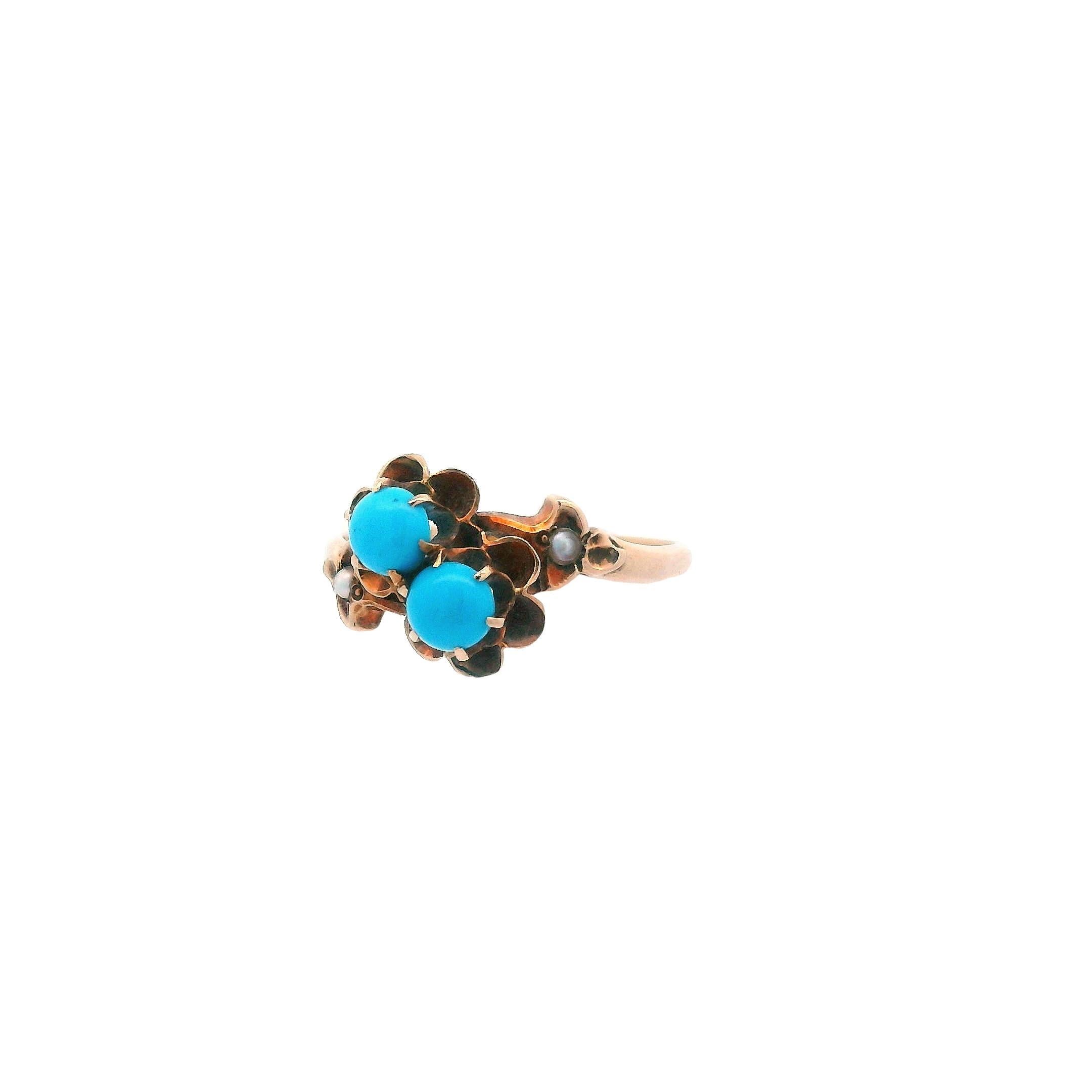 This lovely ring comes from the 1890 Victorian era and is made in 14k yellow gold with both turquoise and seed pearls. This ring is truly special for any lover of turquoise or anyone who enjoys an earth tone ring. The soft turquoise is surrounded by