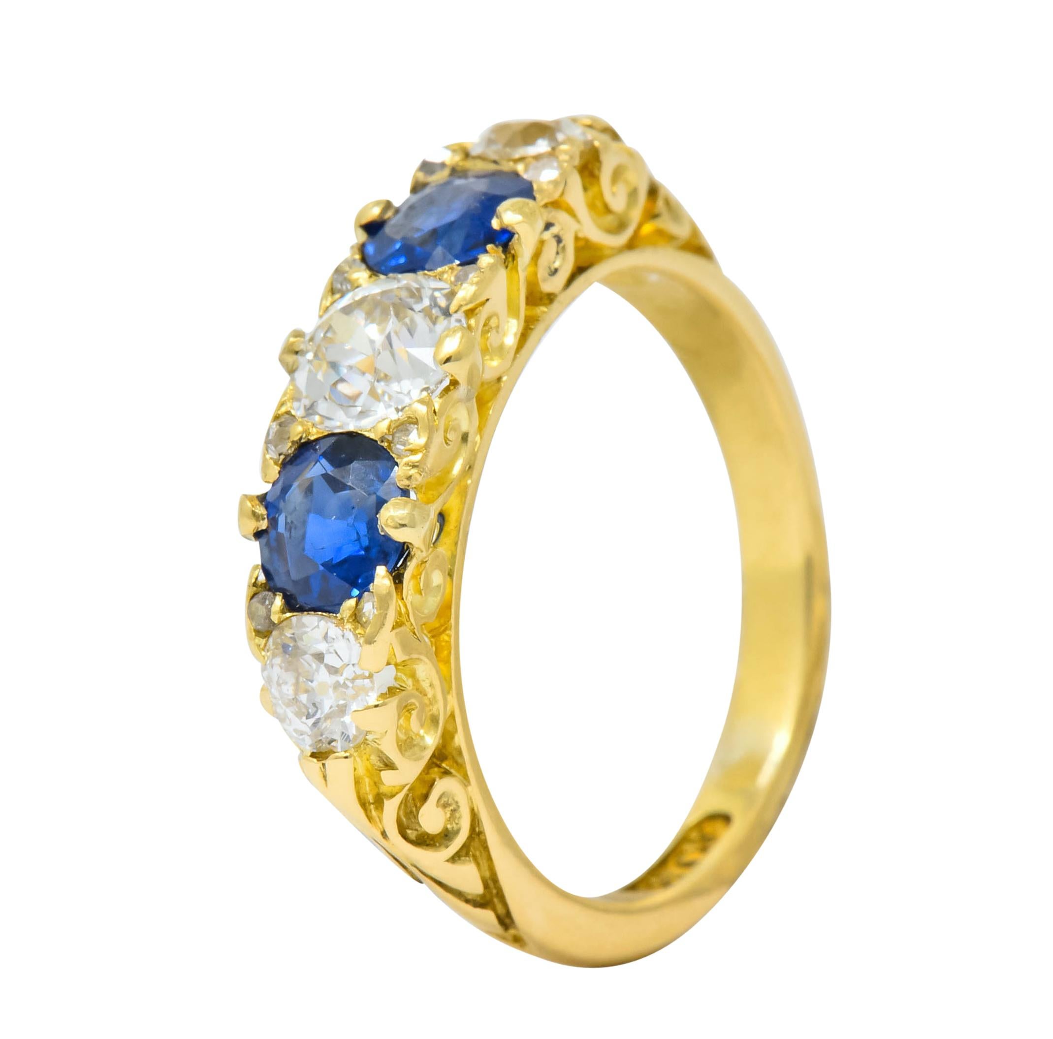 Set to front with old mine cut diamonds weighing approximately 1.55 carat total, I to J color and SI clarity

Alternating with round cut sapphire weighing approximately 0.90 carat total, medium-dark royal blue in color

Shared prong and set to front