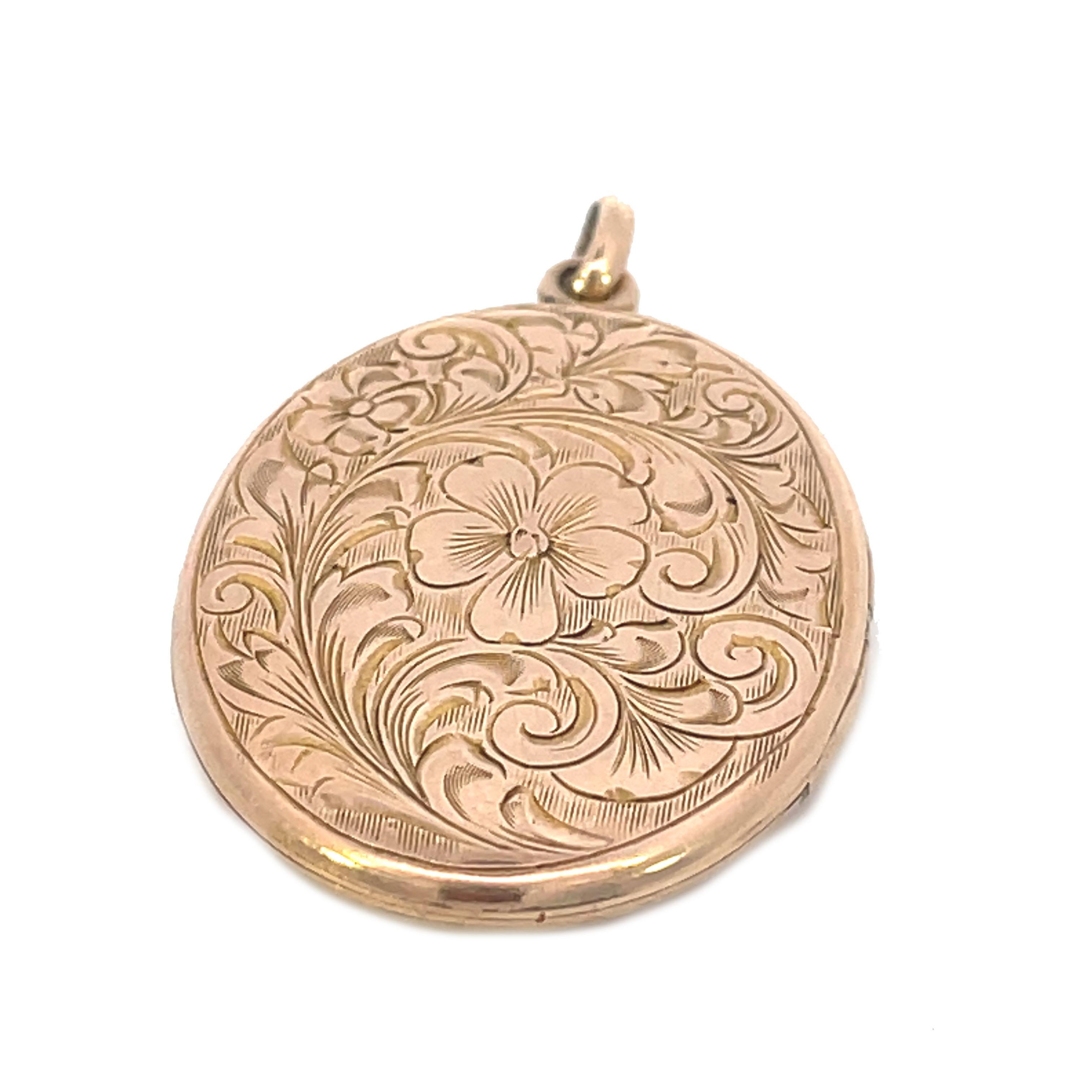 This is a beautiful hand engraved 1890 Victorian locket  in 10K rose gold that showcases a gorgeous hand engraved floral motif. At the center, a beautiful blooming flower surrounded by intricately detailed leaves and fanciful flowing swirls along