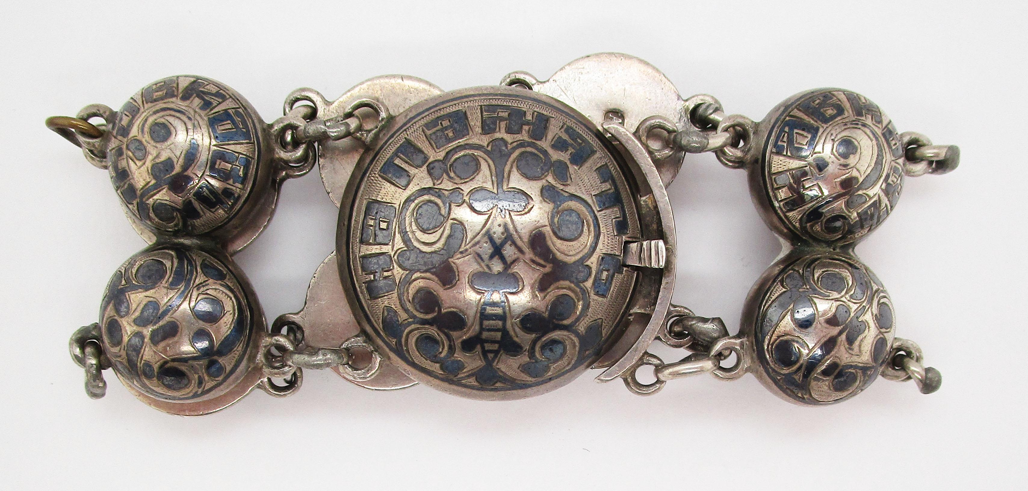 This is an incredibly unique Russian bracelet from the Victorian era in sterling silver and black enamel. The enamel work is incredibly detailed and features swirled patterns that create a dramatic contrast against the brightness of the silver. The