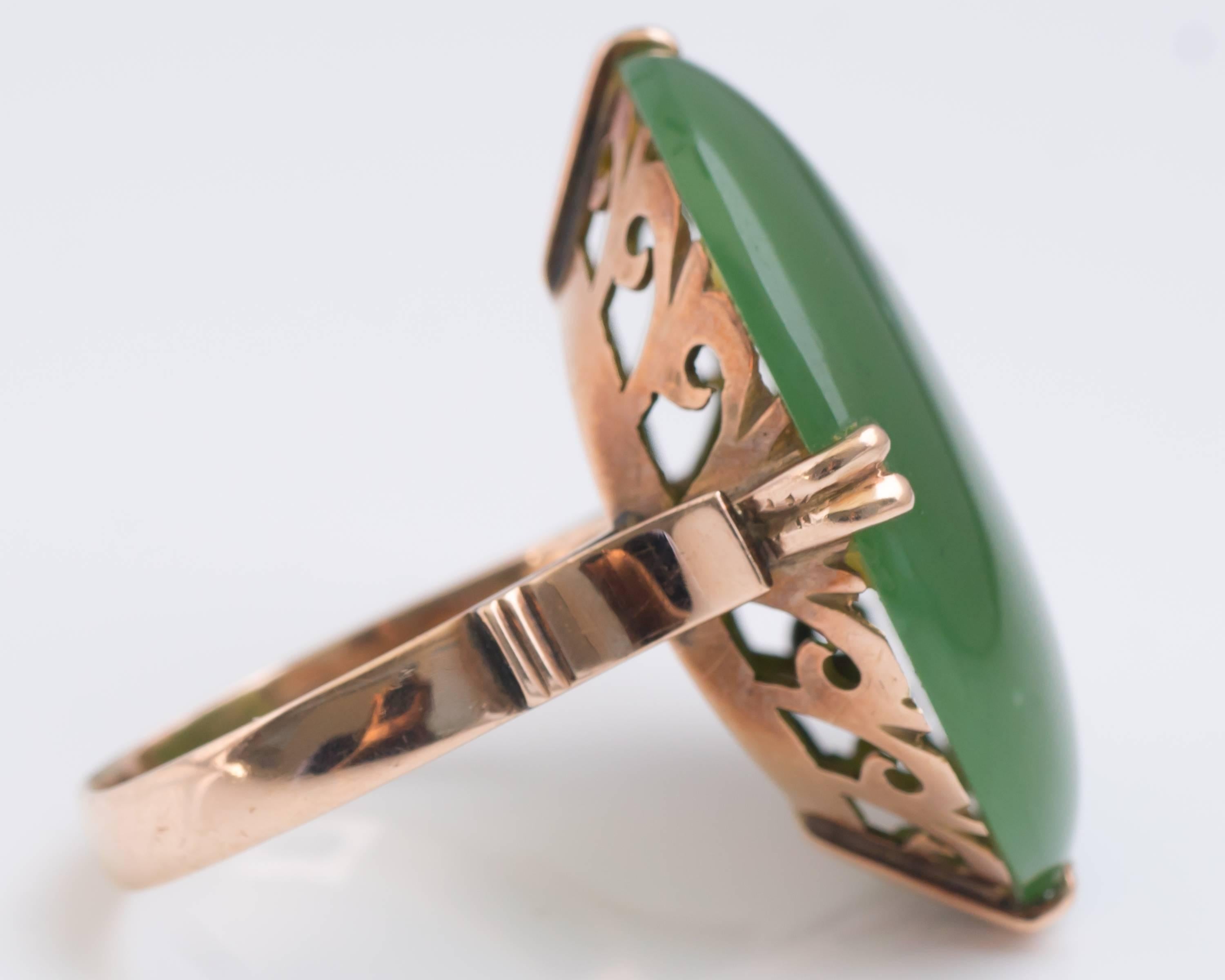 1890s Art Nouveau 18 Karat Rose Gold & Oval Cabochon Nephrite Jade Ring

Features a 7 carat Jade cabochon in an ornate 18 Carat Rose Gold setting. The Nephrite Jade is securely set with 4 double claw prongs. The Jade Cabochon is an excellent deep