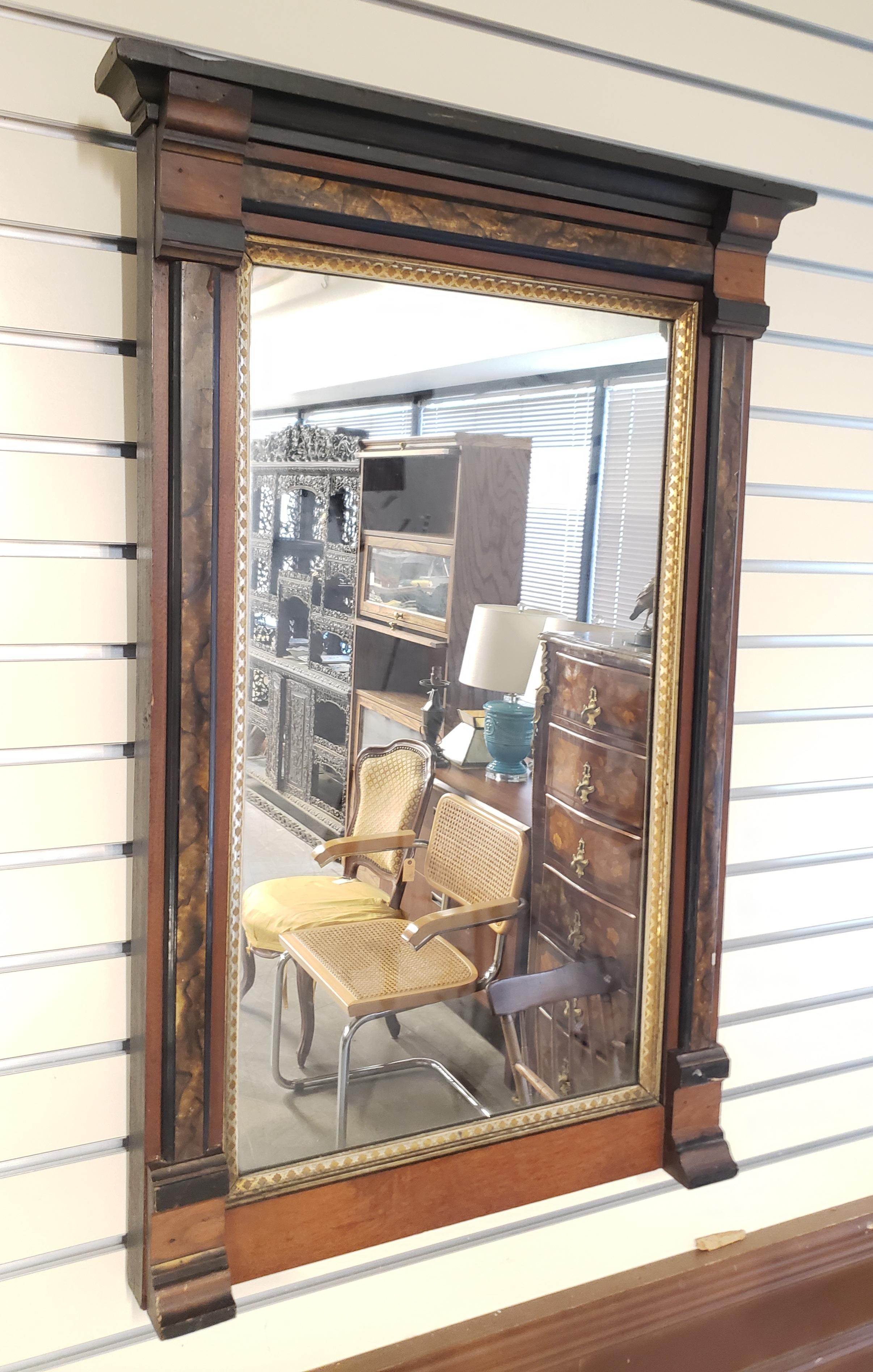 1890s American classical parcel ebonized mahogany wall mirror.
Measures 35