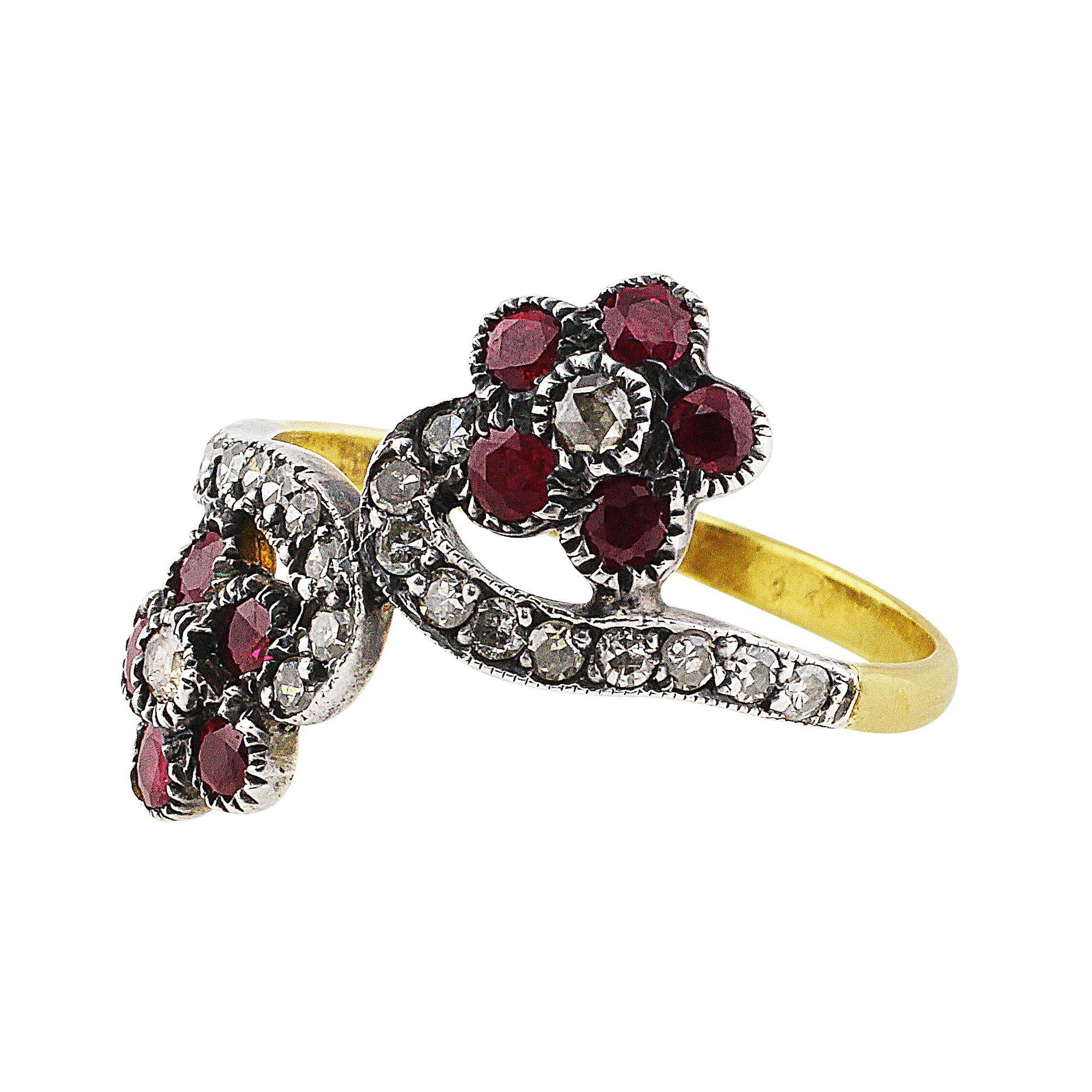 1890's Flower Diamond Ruby Ring. Antique 18k yellow gold flower-shaped ring set with diamonds and rubies. This estate ring is dated circa the 1890s.