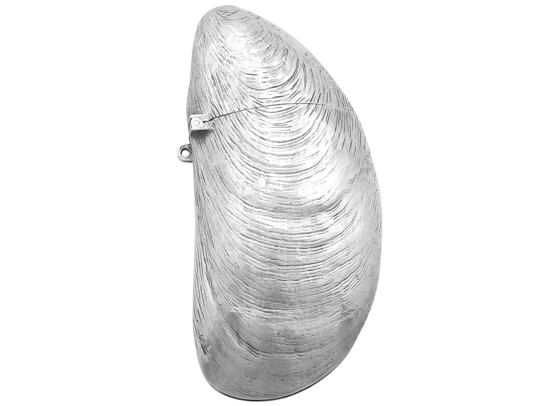 An exceptional, fine and impressive antique French silver vesta case in the form of a mussel; an addition to our diverse smoking related silverware collection

This exceptional antique French silver vesta case has an elongated asymmetrical form,