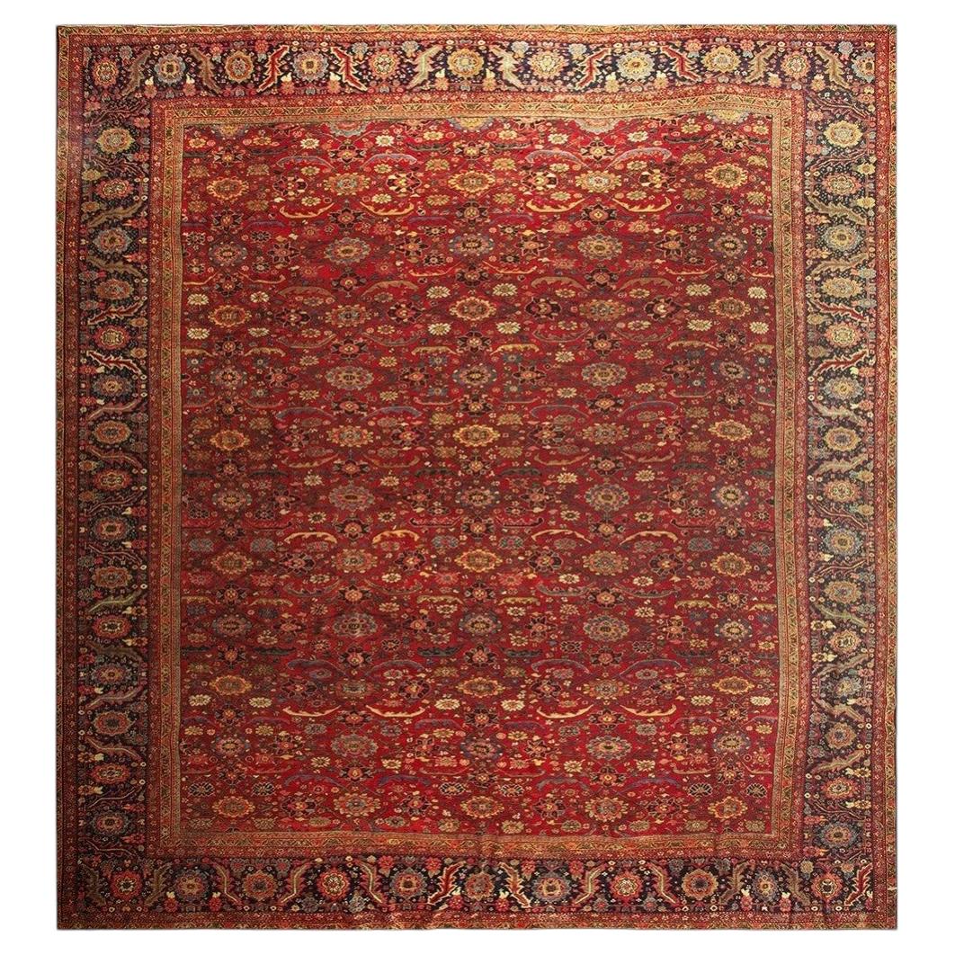 1890s Antique Red Ground Overscale Botanical Handknotted Wool Sultanabad Rug For Sale