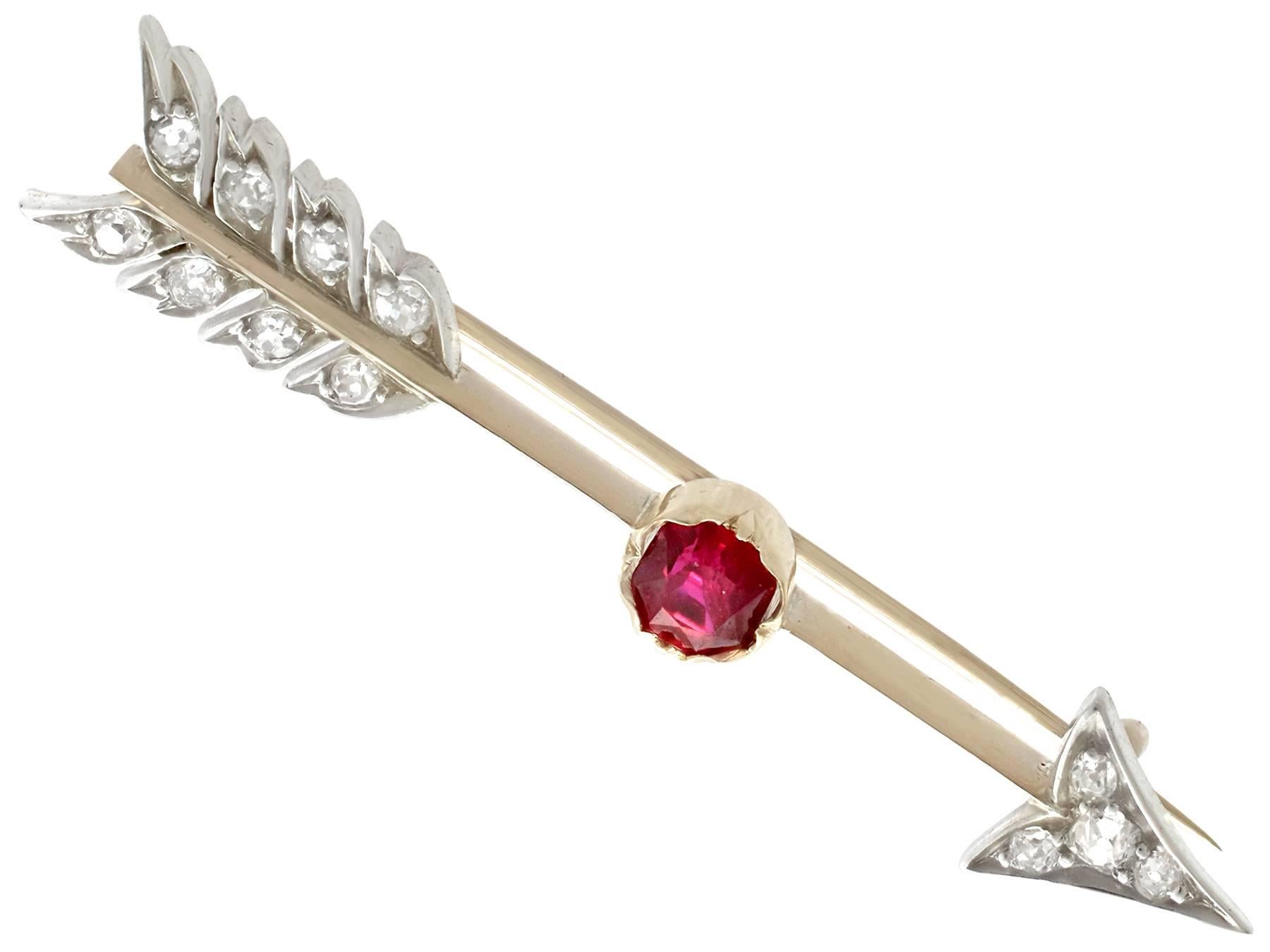 An impressive antique Victorian 0.82 carat ruby and 0.26 carat diamond, 15 karat yellow gold and silver set 'arrow' brooch; part of our diverse ruby jewellery collections.

This fine and impressive Victorian arrow brooch has been crafted in 15k