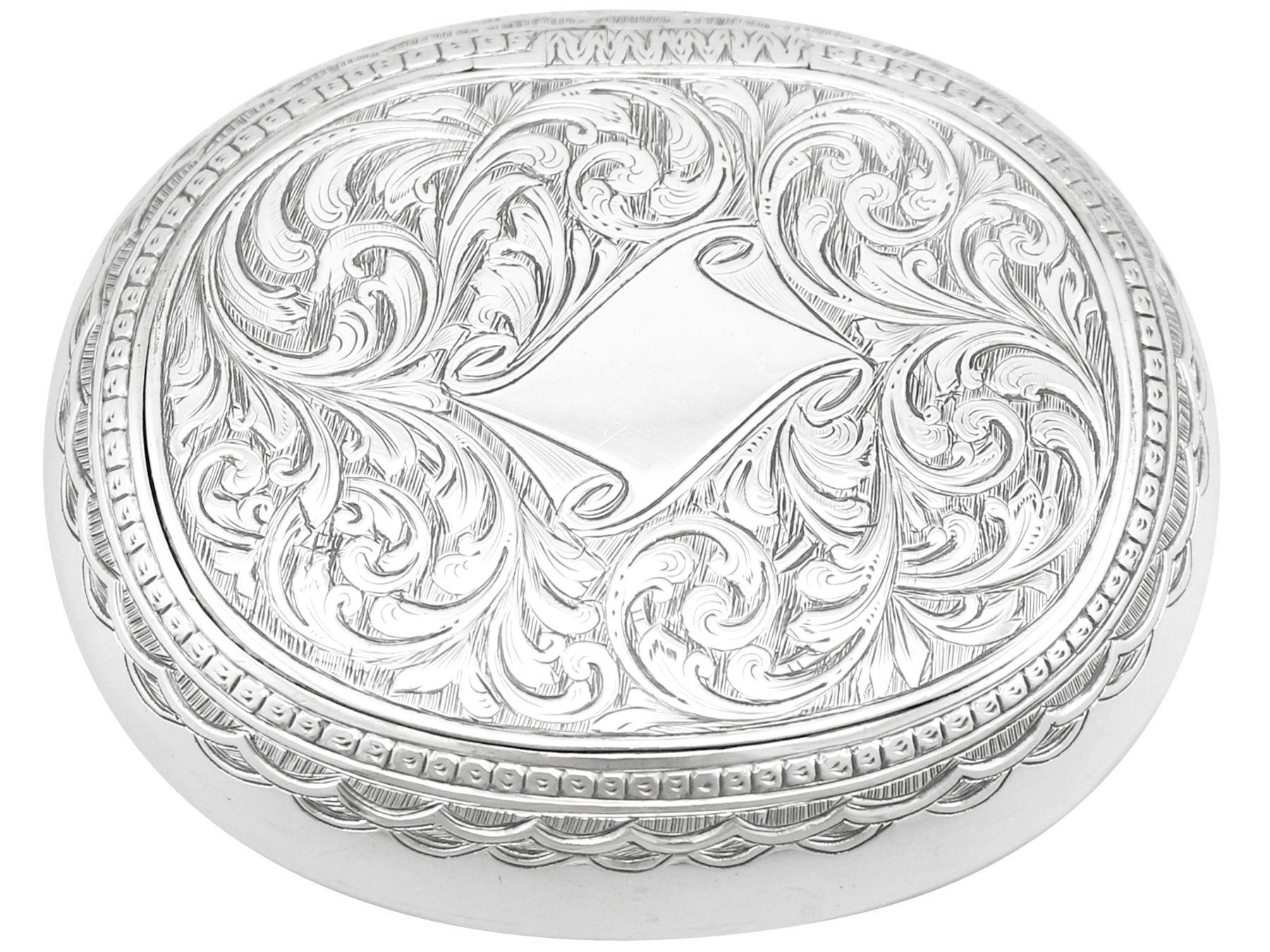 An exceptional, fine and impressive antique Victorian English sterling silver tobacco box; an addition to our smoking related silverware collection.

This exceptional antique Victorian sterling silver tobacco box has a plain oval rounded