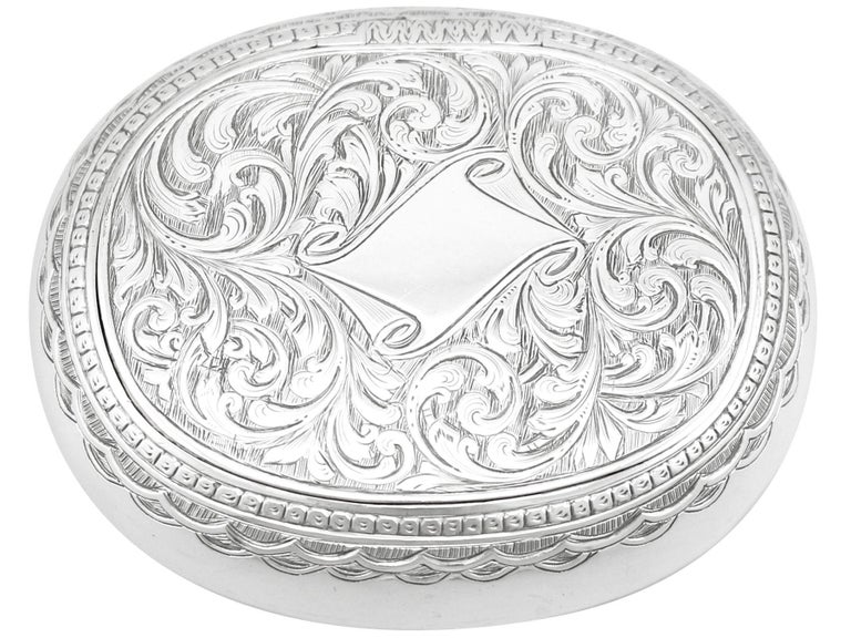 An exceptional, fine and impressive antique Victorian English sterling silver tobacco box; an addition to our smoking related silverware collection.

This exceptional antique Victorian sterling silver tobacco box has a plain oval rounded form.

The