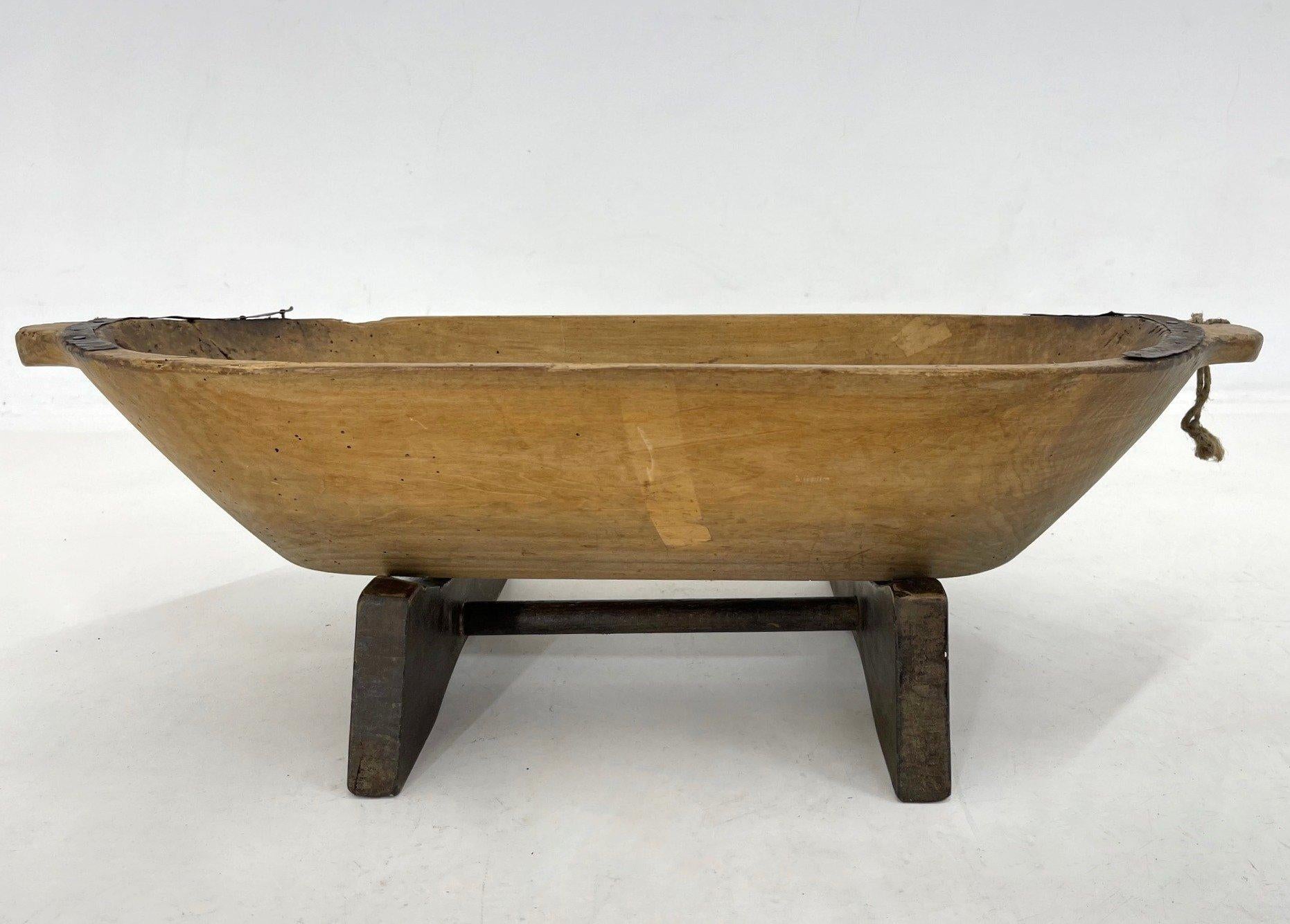 Antique wooden dough trough with metal details on original stand in unrestored, untreated original condition. A beautiful home decoration that can be used in many different ways. The hight without the stand is 13 cm.