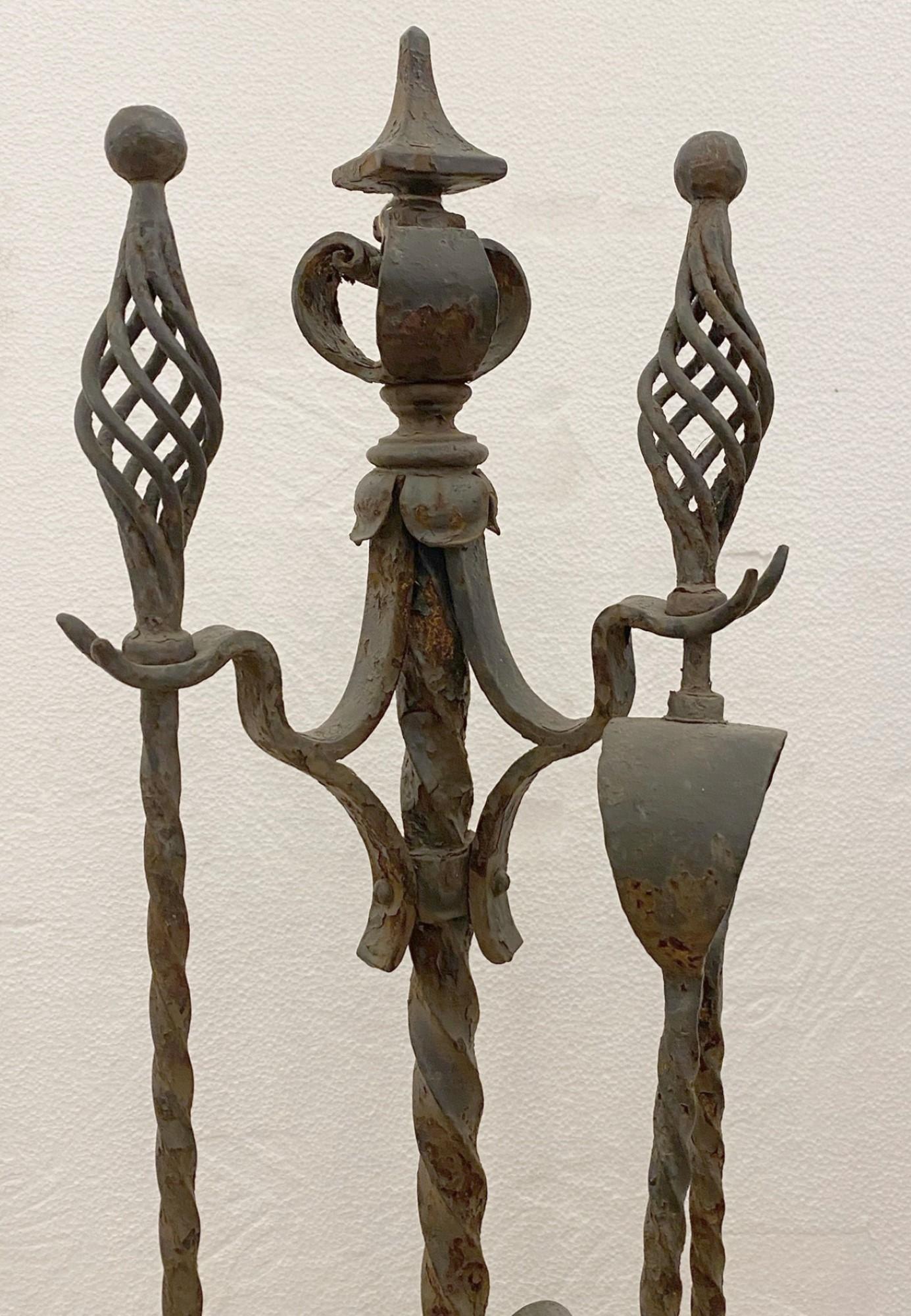 1890s set of wrought iron fireplace tools with a black finish. Please note, this item is located in one of our NYC locations.
