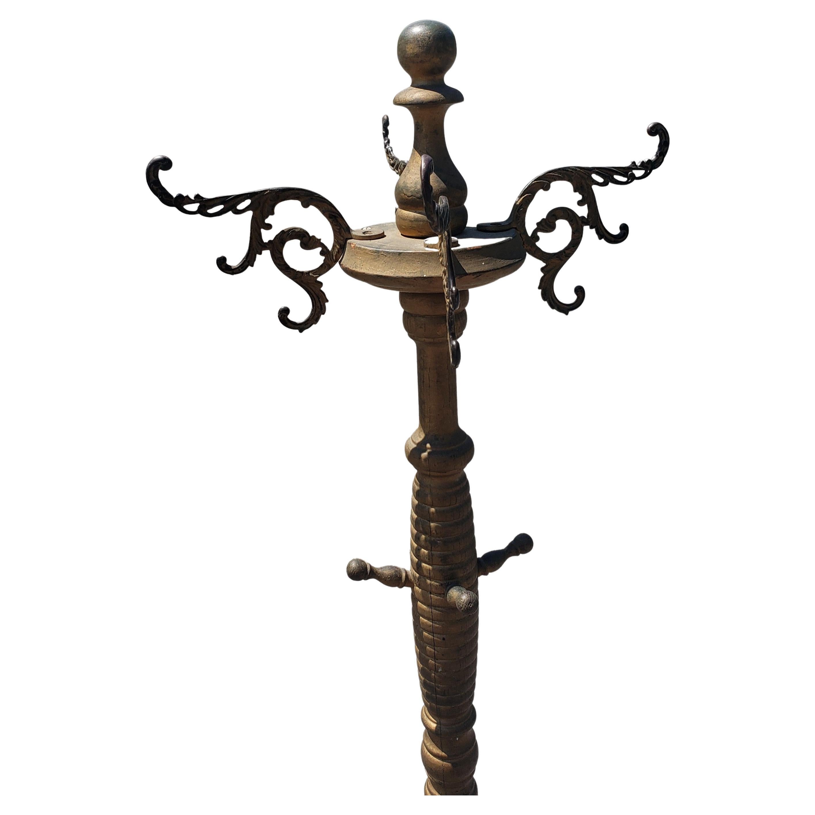 A late 19th Century giltwood arts and craft coat and hats rack / stand. Measures 17.5 inches square at the base and stands 69 inches tall.
 