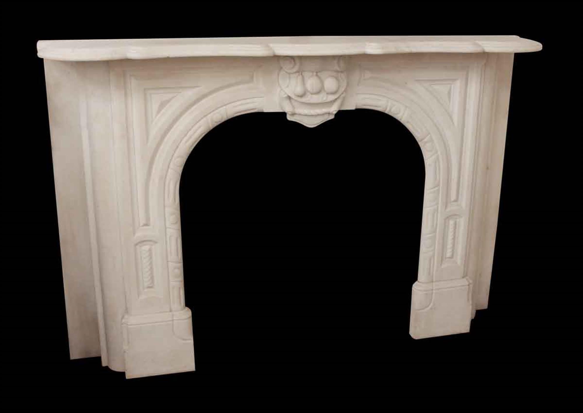 1890s white hand carved marble mantel with decorative carvings throughout. Fruit details in the center of the keystone. Rescued from a Manhattan apartment this can be seen at our 2420 Broadway location on the upper west side in Manhattan.