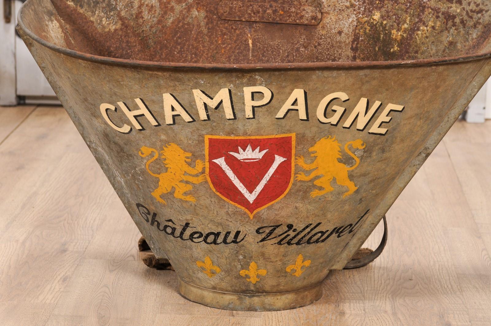A French grape picking hod from circa 1890 with Château Villaret Champagne label and distressed patina. This charming French grape picking hod, circa 1890, tells a story of heritage and craftsmanship. Boasting a distressed patina, this piece carries