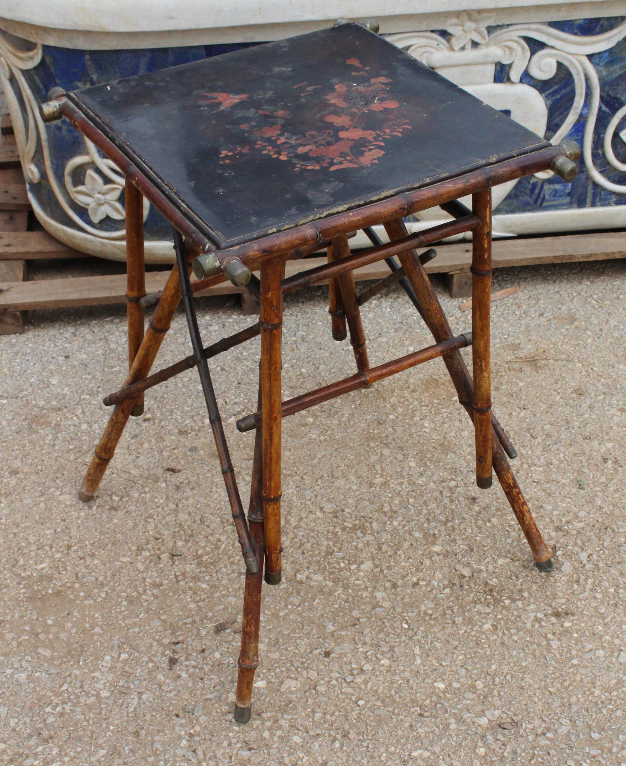 1890s Chinese bamboo side table with flower and bird painted black lacquer top and bronze fittings.


 