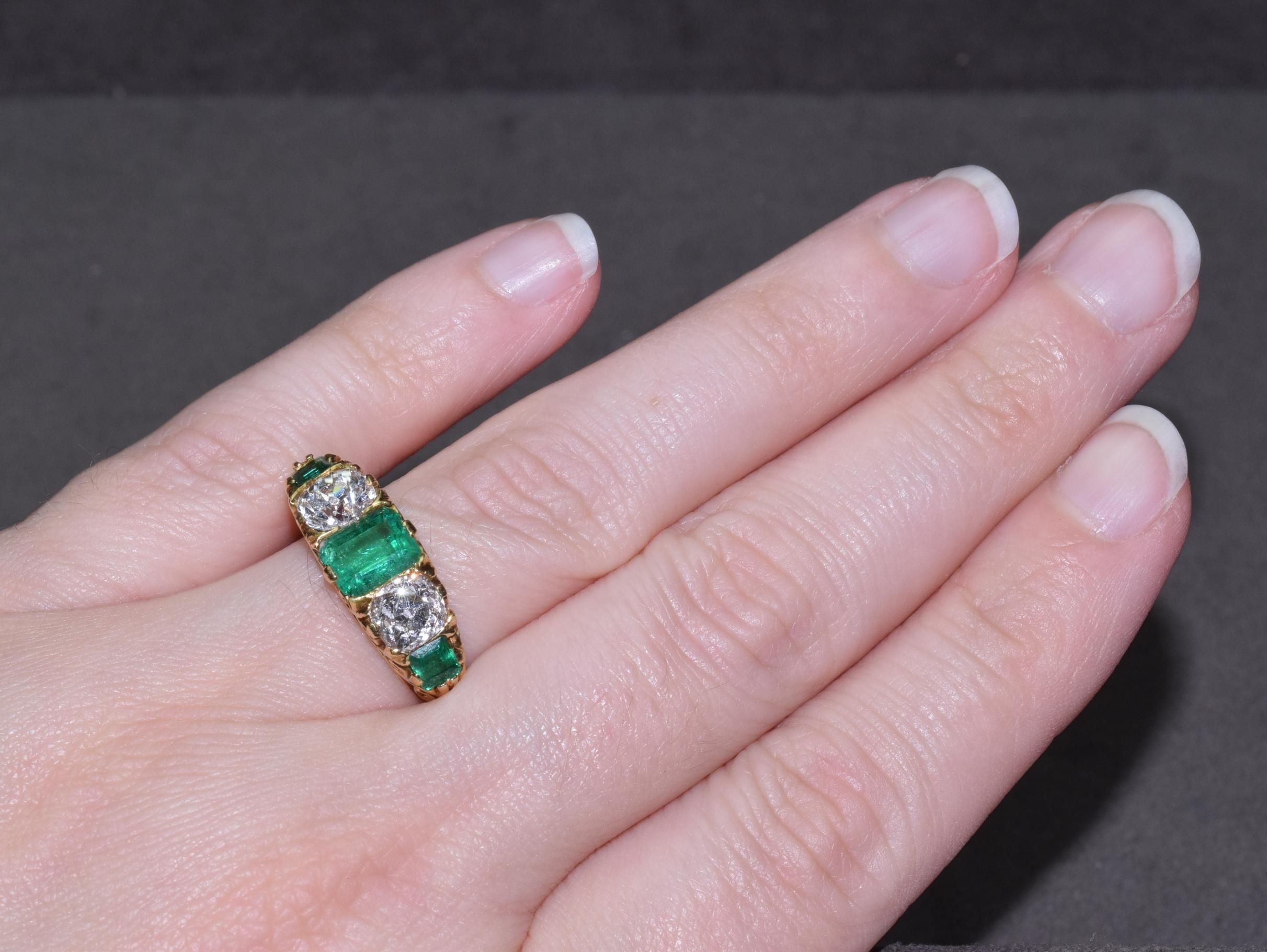 Set with an alternating graduated series of emerald-cut emeralds and old mine-cut diamonds, mounted in 18k gold

Total weight of the emeralds approximately 1.65 carats
Total weight of the diamonds approximately 1.50 carats
 
The ring is currently a