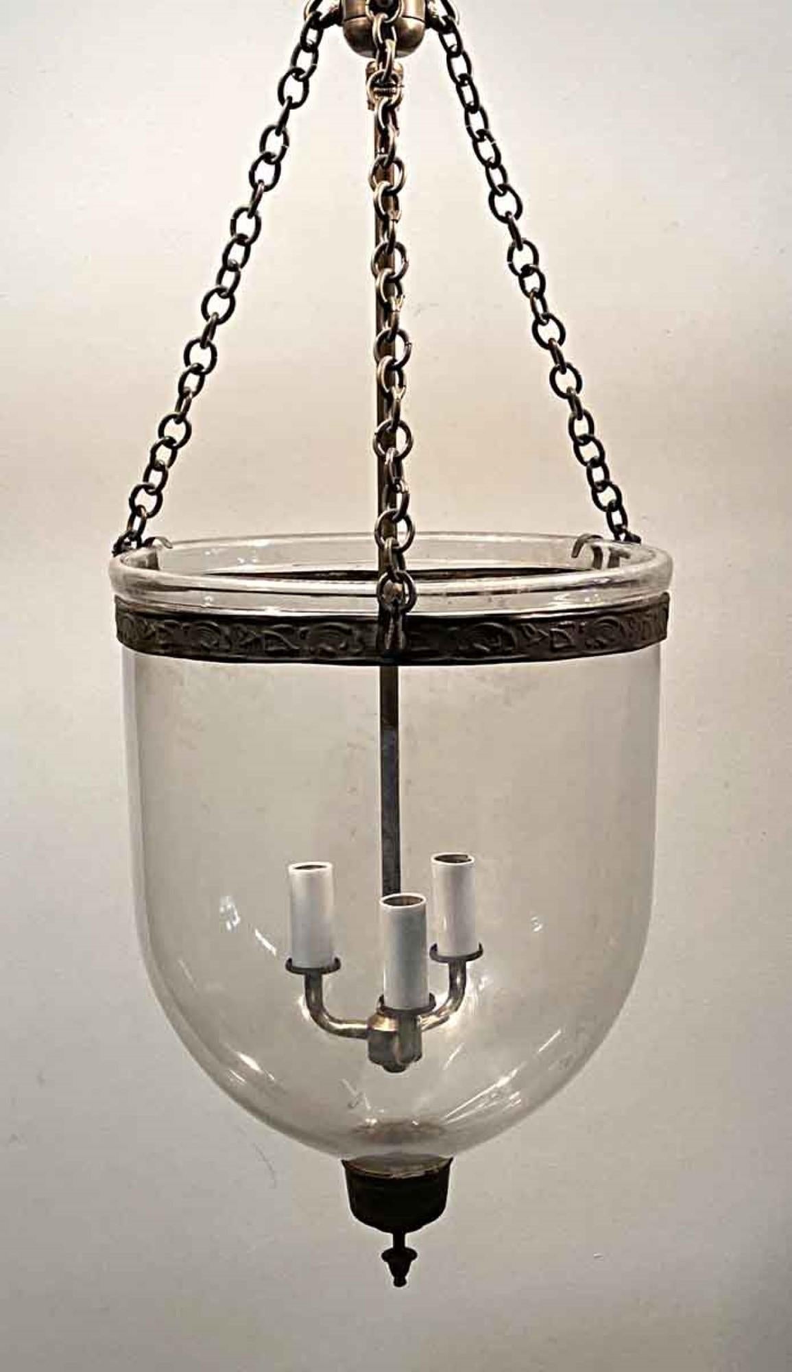 1890s English hand blown glass bell jar pendant lantern with original brass finial. Features new brass hardware and three candelabra lights. This can be seen at our 400 Gilligan St location in Scranton. PA.
