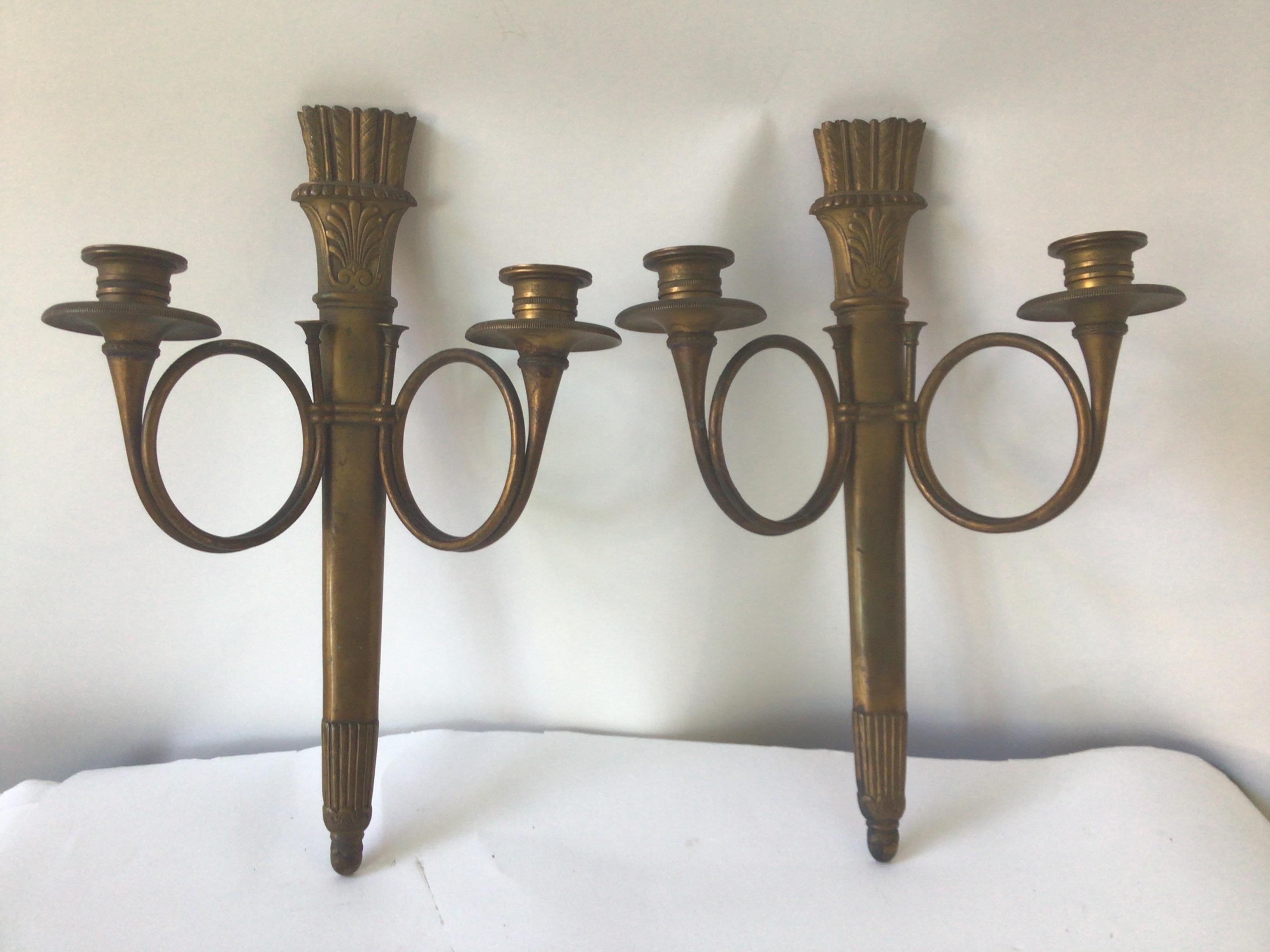 1890s French empire bronze sconces. There is no hole in the arm, so either you have to run the wire on the outside of the arm (a French wire), or use candles.