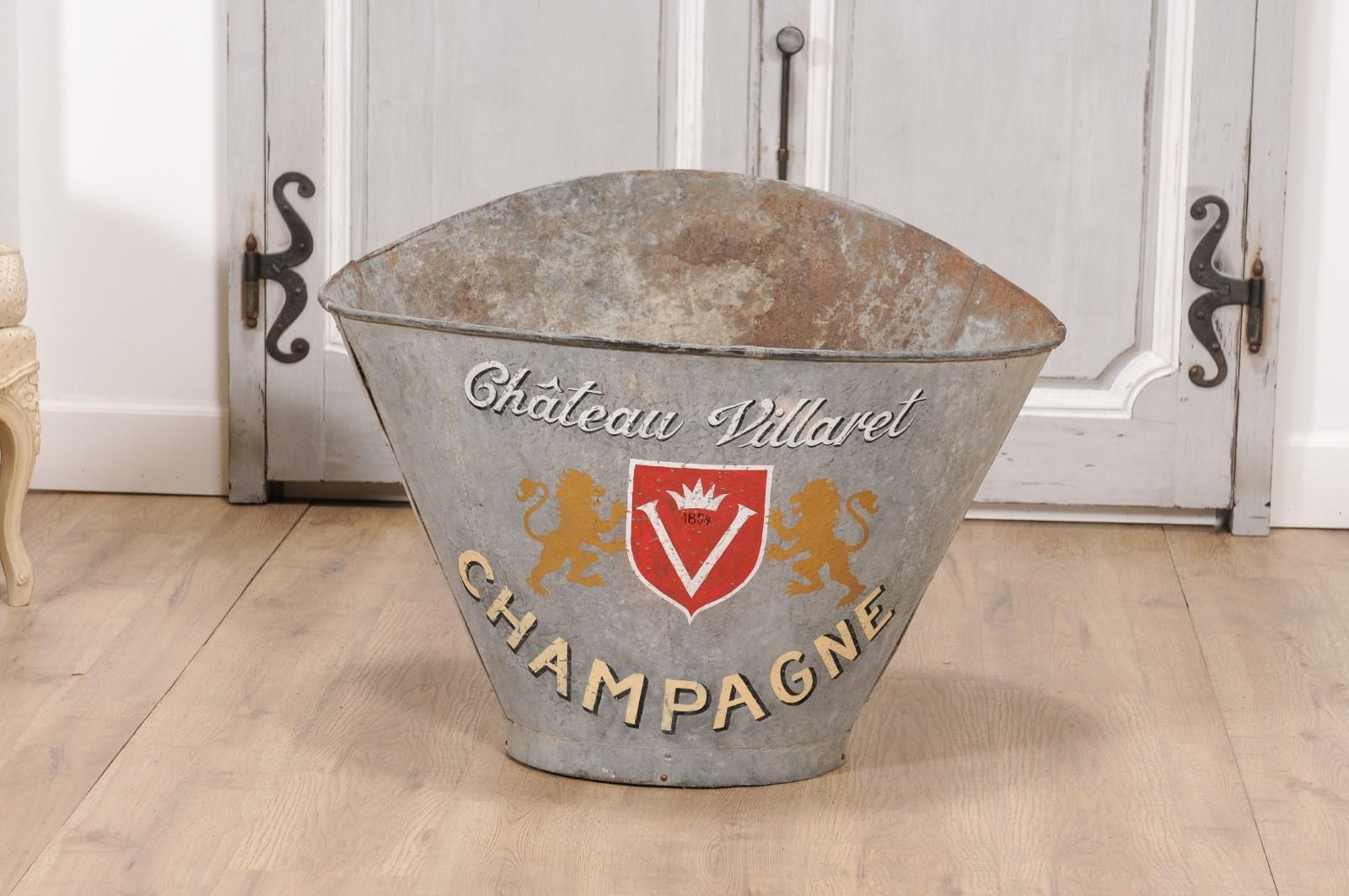 A French alumunium grape picking hod from circa 1890 with Château Villaret Champagne label. Immerse yourself in the historic charm of French winemaking with this vintage grape picking hod from the late 19th century. A tangible reminder of the