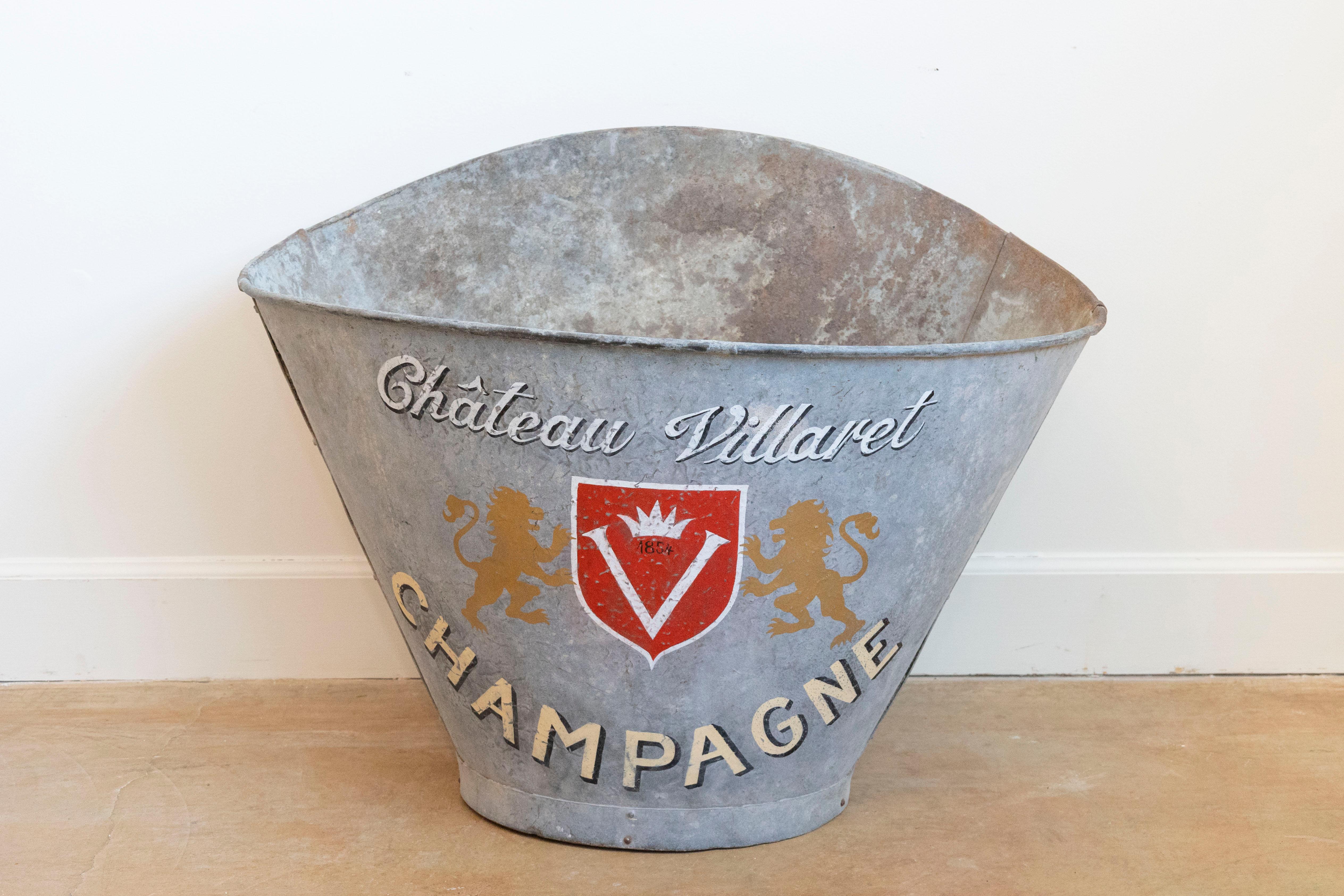 A French alumunium grape picking hod from circa 1890 with Château Villaret Champagne label. Immerse yourself in the historic charm of French winemaking with this vintage grape picking hod from the late 19th century. A tangible reminder of the