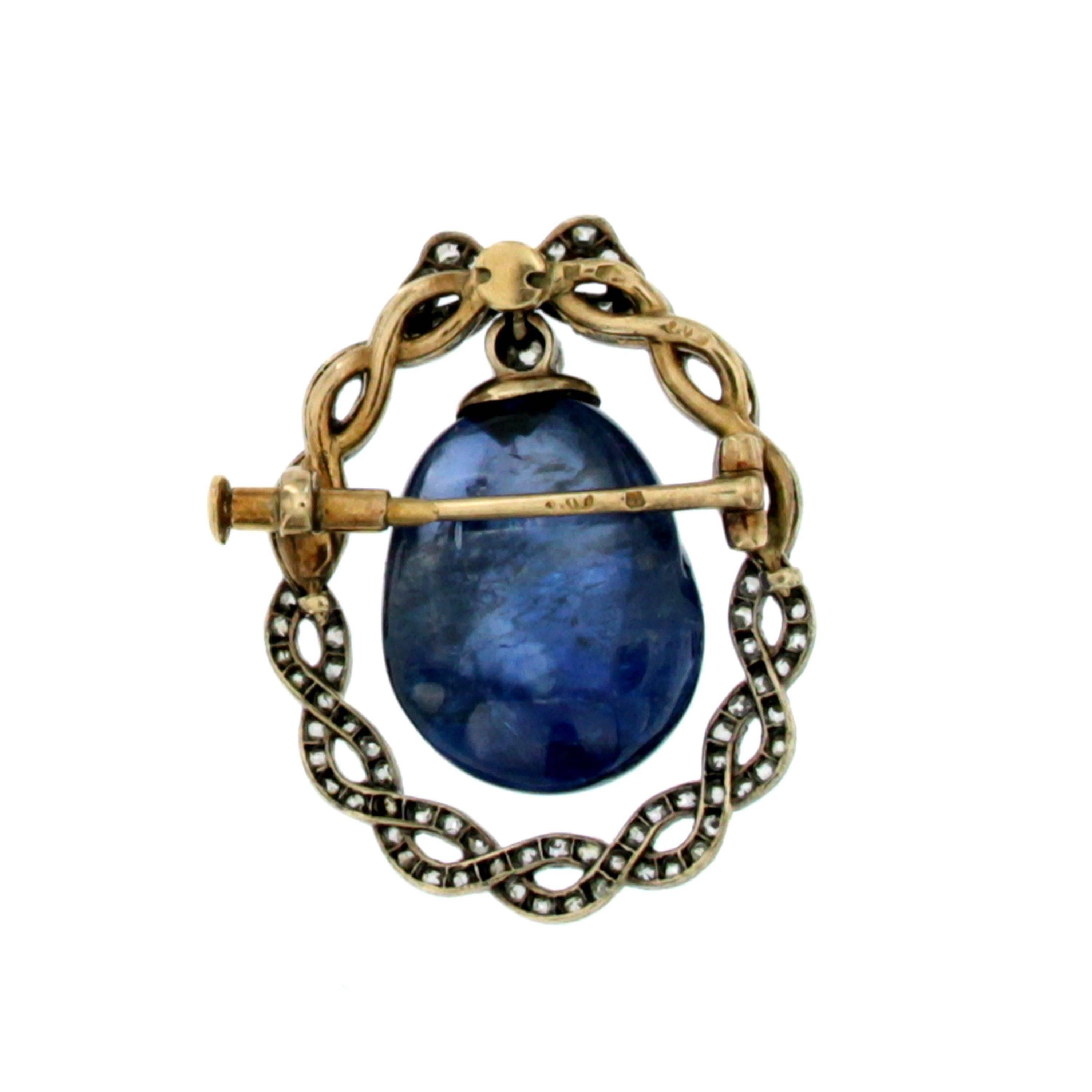 Unique piece, exquisite jewel to wear or to collect, in any case it is a must have!

Hand crafted in 18k gold and silver, it features a large Vivid blue natural Sapphire, the cut of the stone is an unusual custom cabochon polished of approx. 10