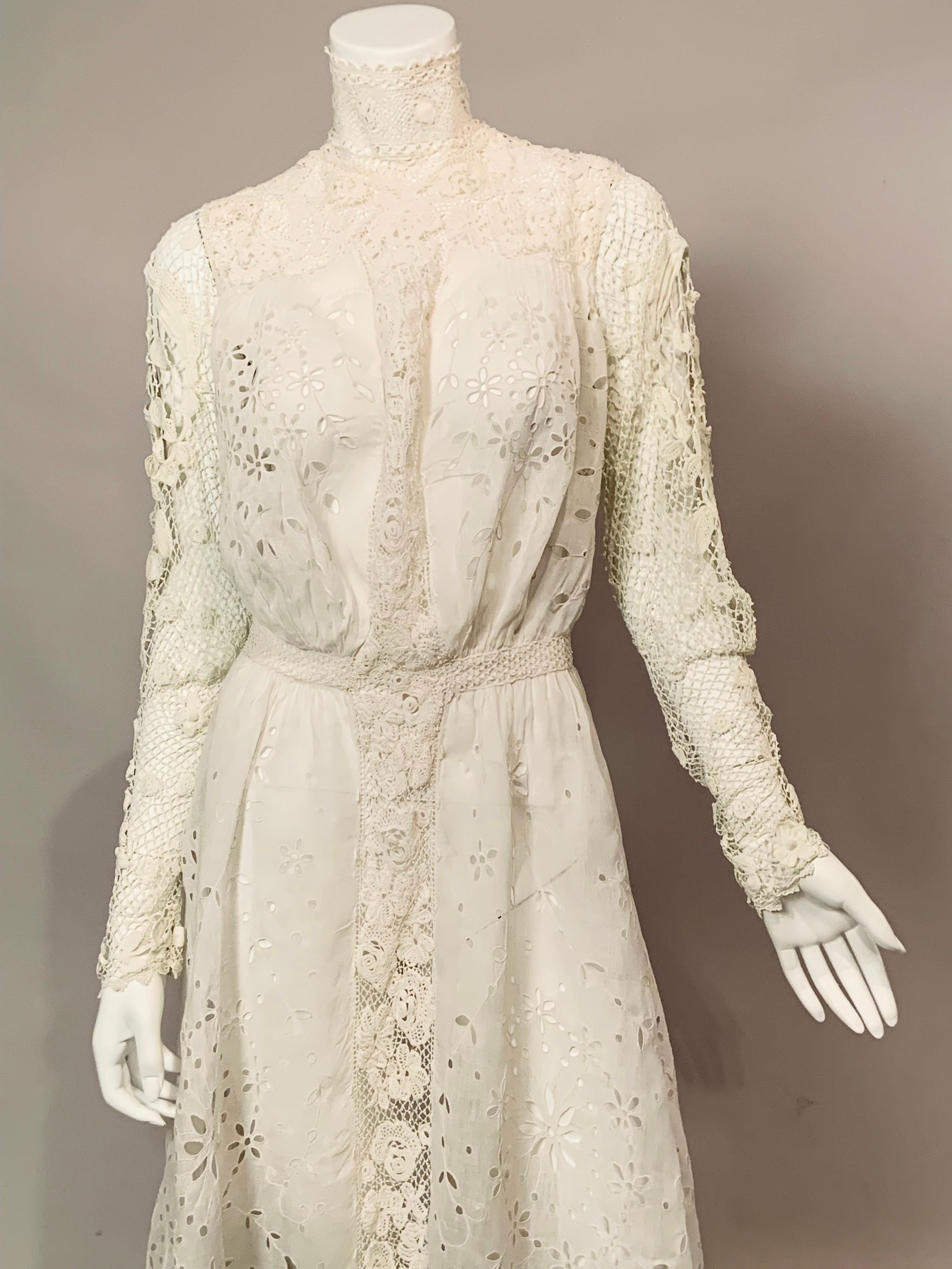This charming Victorian dress is a combination of hand made Irish lace and hand embroidered cut work in a floral pattern on fine white handkerchief linen.  The high Irish lace collar was popular in the 1890's and this is combined with an Irish lace