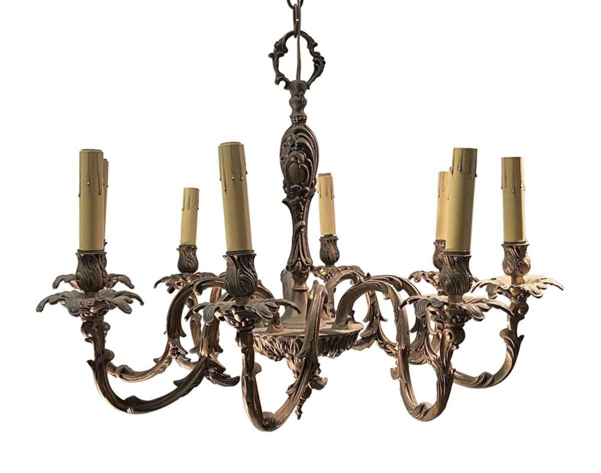 1890 cast bronze Rococo style eight arm French chandelier with organic foliage detail. This can be seen at our 400 Gilligan St location in Scranton. PA.