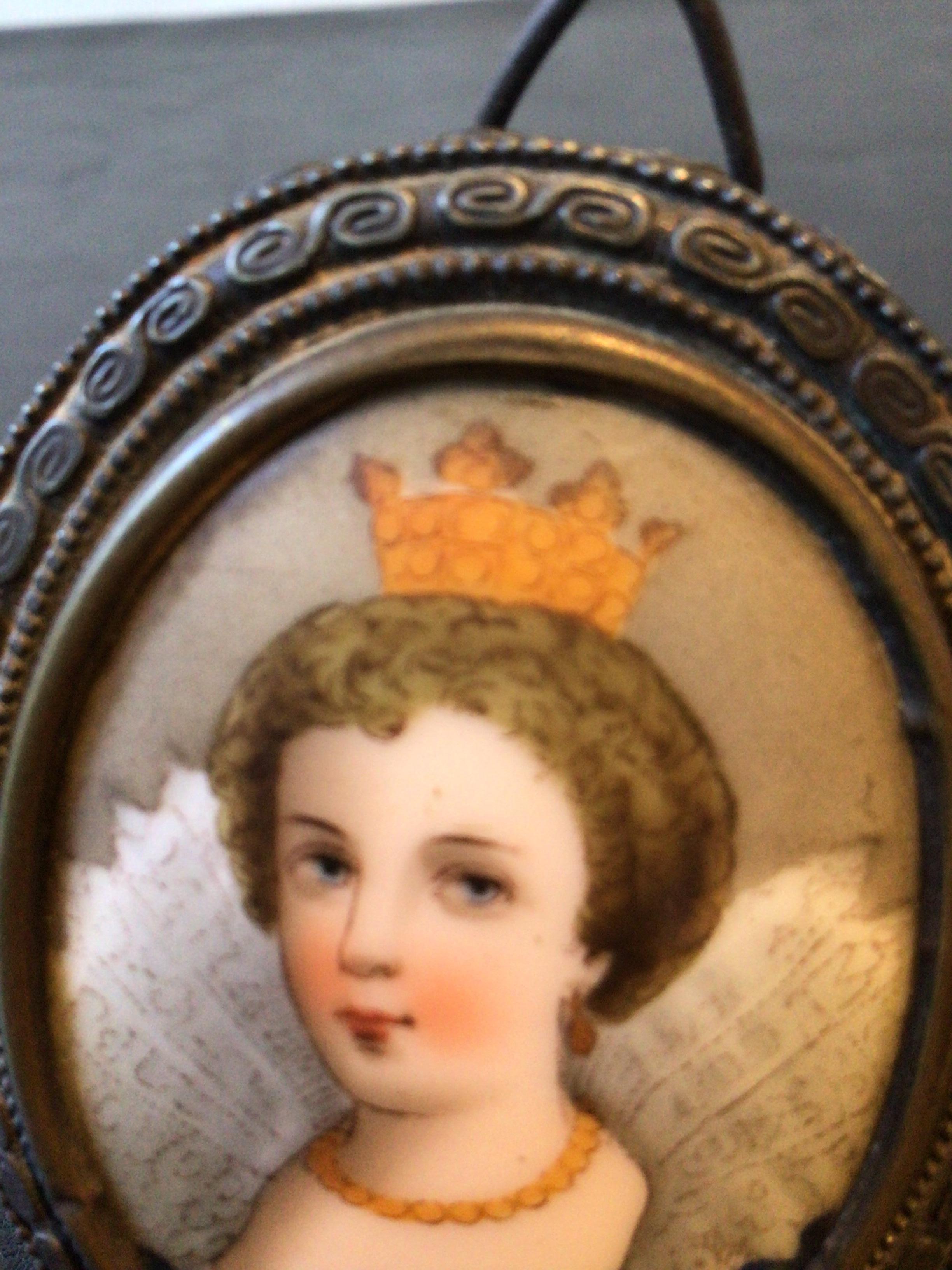 1890s Minature painting of a queen on ceramic in a brass frame.