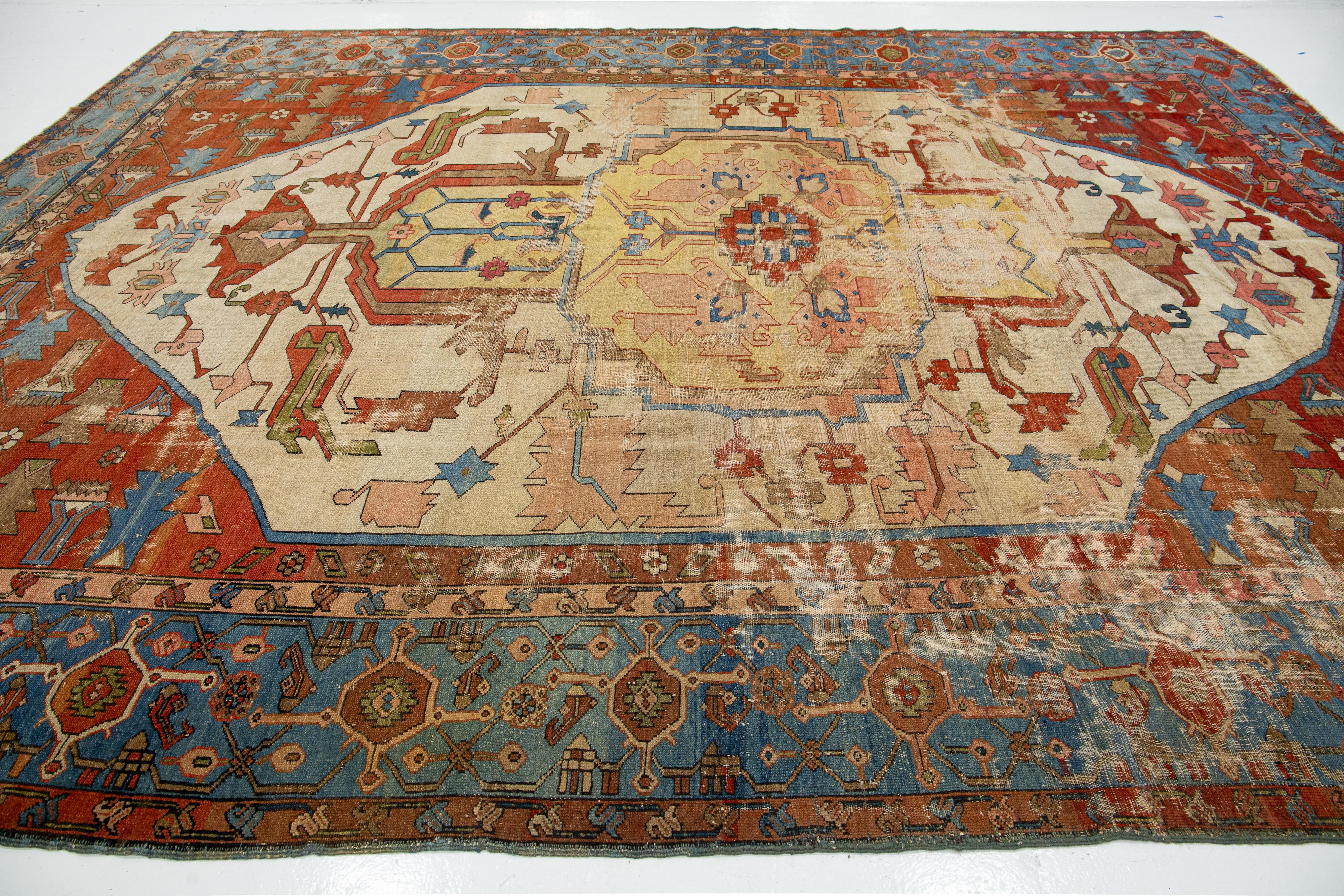 1890s Multicolor Antique Wool Rug Persian Serapi Featuring a Medallion Design  In Fair Condition For Sale In Norwalk, CT