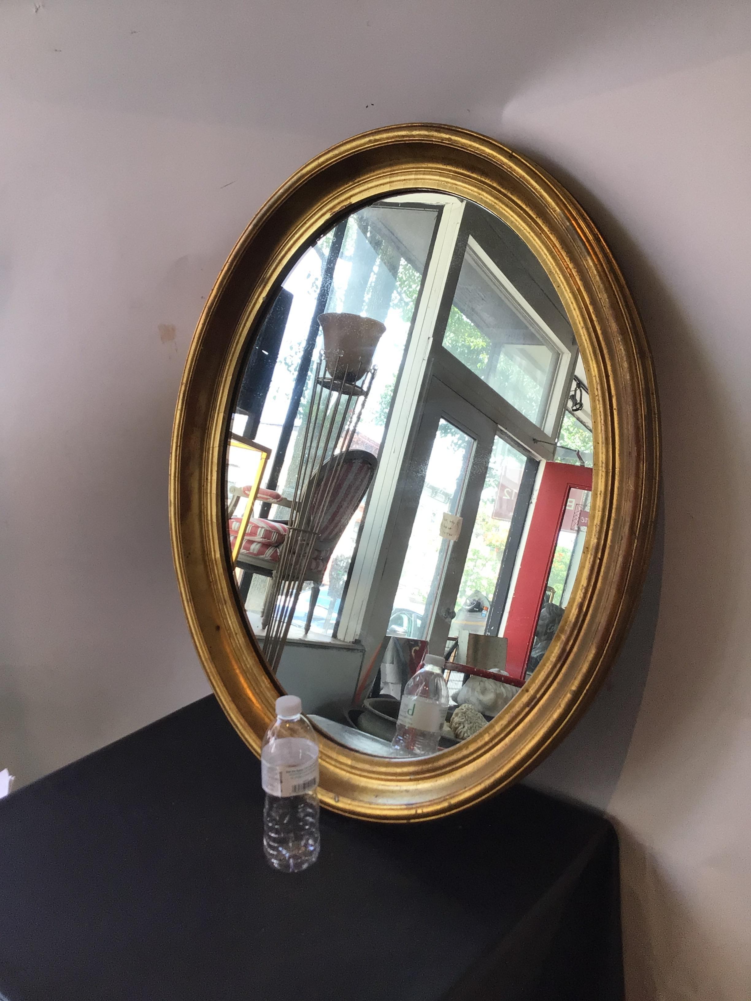 1890s Gilt wood oval mirror from a Southampton, NY estate.