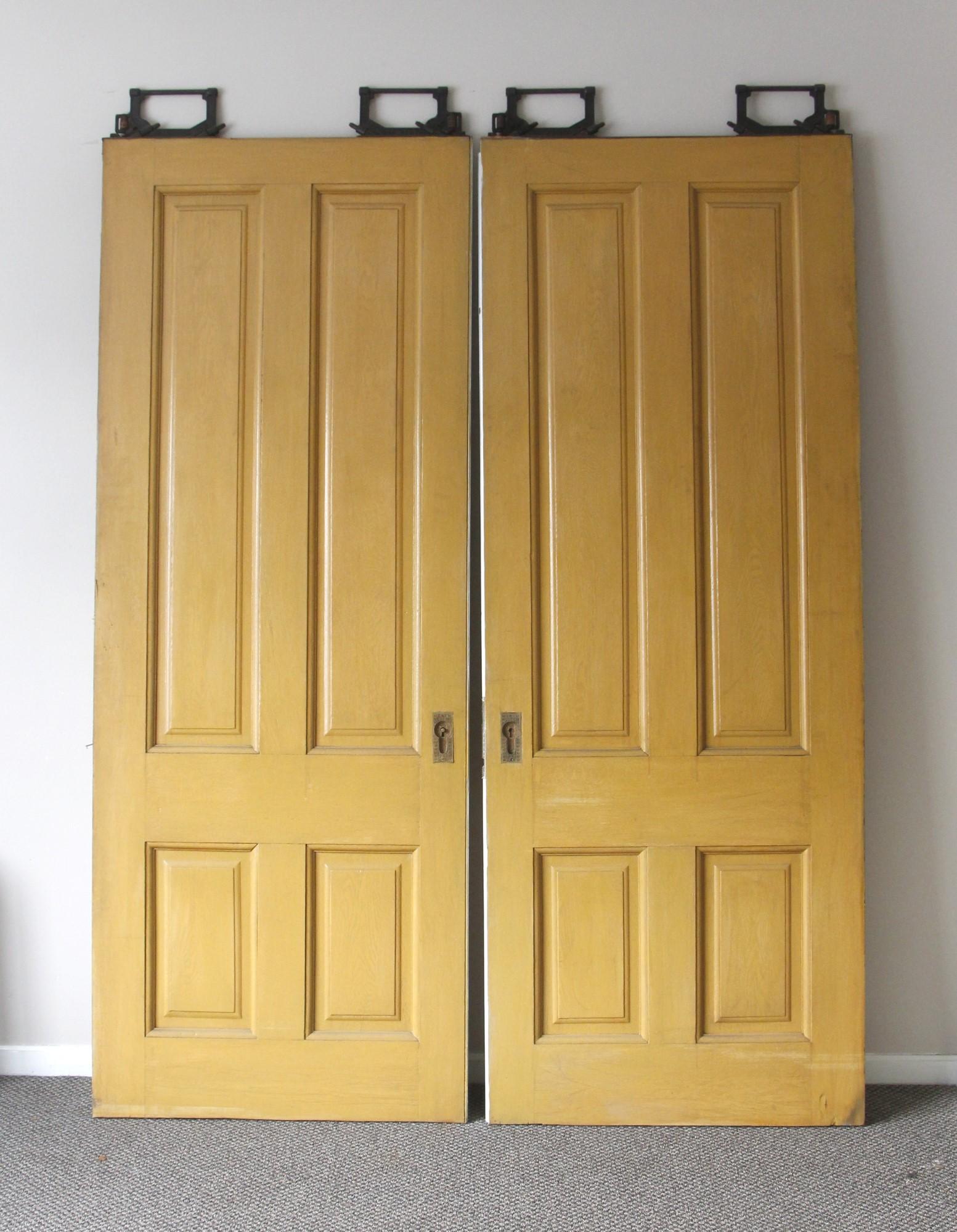 1890s Pair 4 Panel Wood Pocket Doors with Rollers Doors Alone Total In Good Condition In New York, NY
