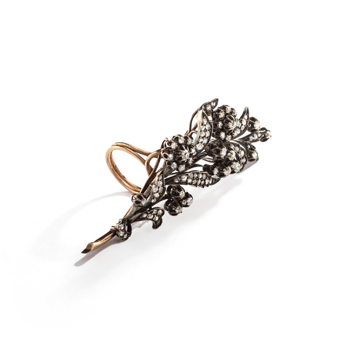 This captivating ring from the late 1890s boasts a timeless elegance that is sure to capture your heart. 
Crafted with meticulous attention to detail, it features a beautiful combination of silver and gold, with the gold being of the exquisite 14K