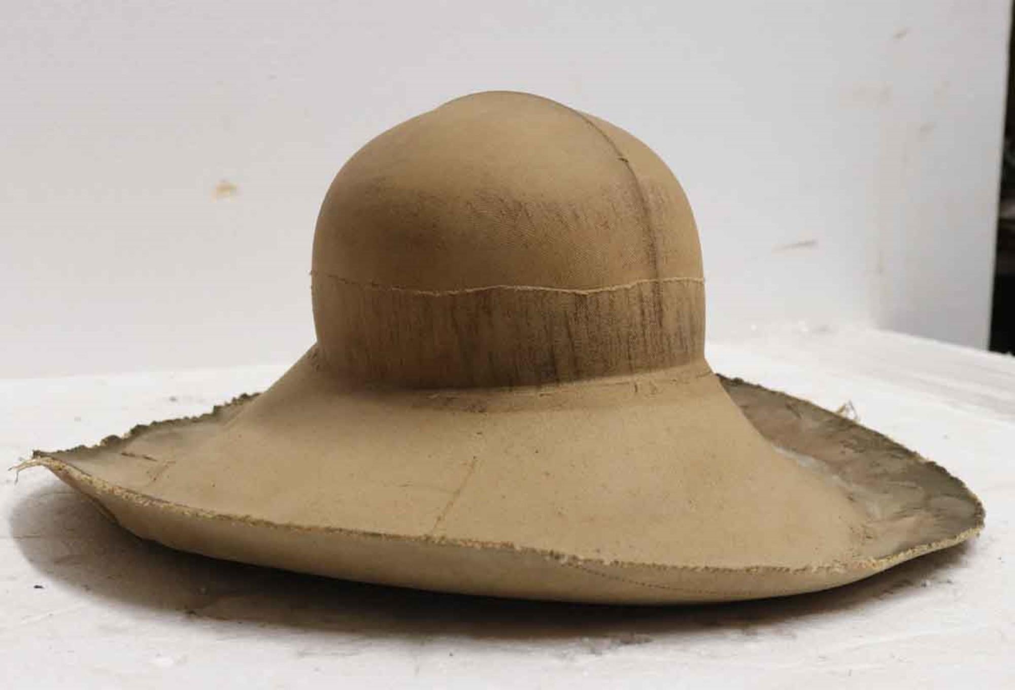 1890s antique French hat mold made of lacquered canvas. Signed on the bottom. This can be seen at our 302 Bowery location in NoHo in Manhattan.
