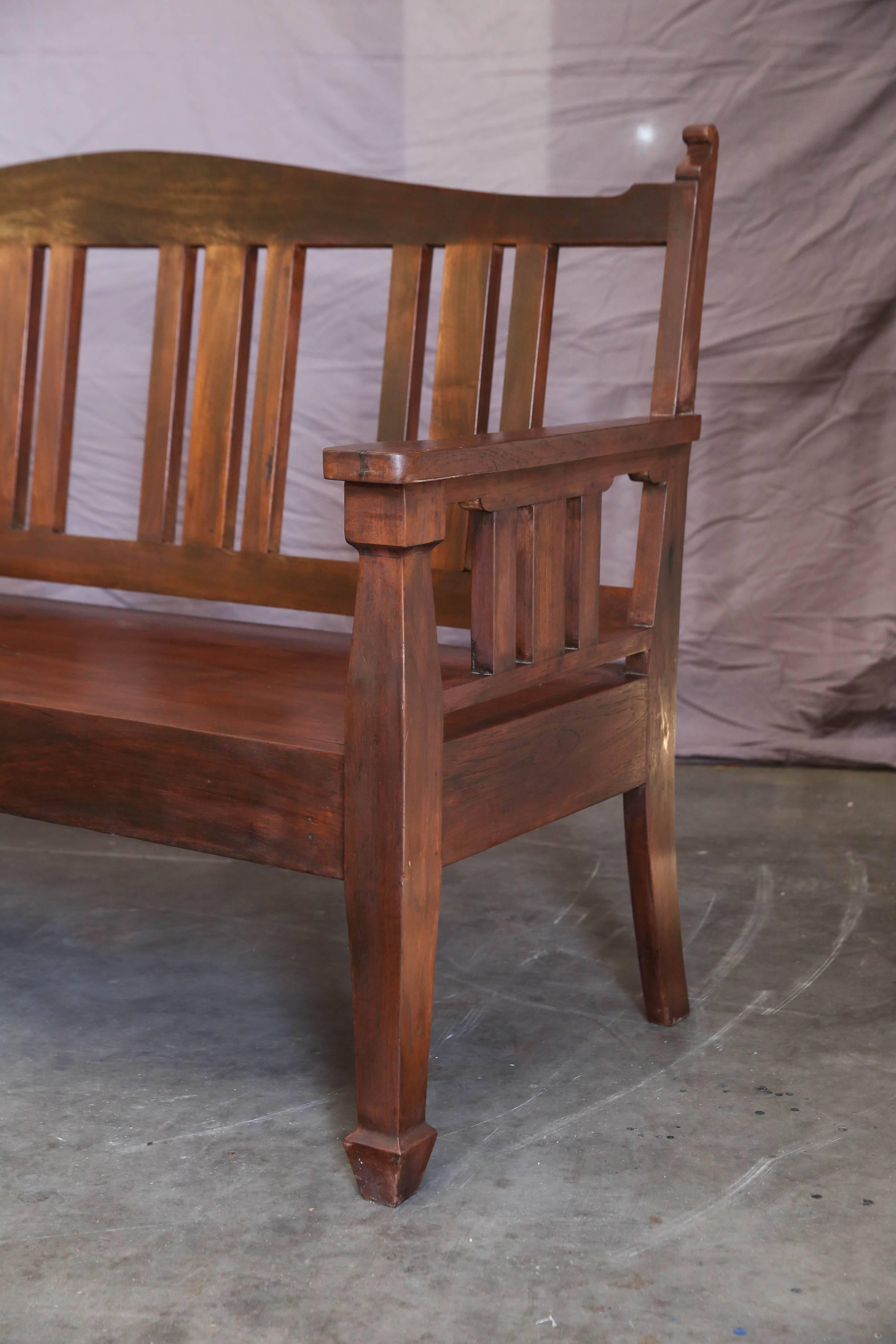 Made on commission for the owners of tea plantation situated on the hill station Darjeeling. Heavily built with no regard to cost. Supported on four sturdy legs, back and arm rests . Old world carpentry. Rich teak wood patina. Used in any style