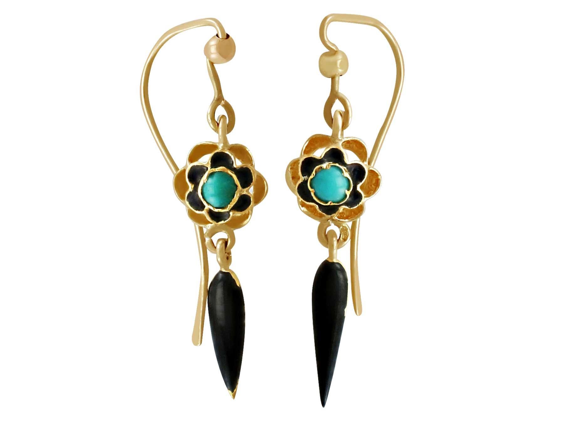 A fine and impressive pair of Victorian turquoise and enamel, 18 karat yellow gold drop earrings; part of our antique jewelry and estate jewelry collections.

These fine and impressive antique turquoise earrings are crafted in 18k yellow gold.

The