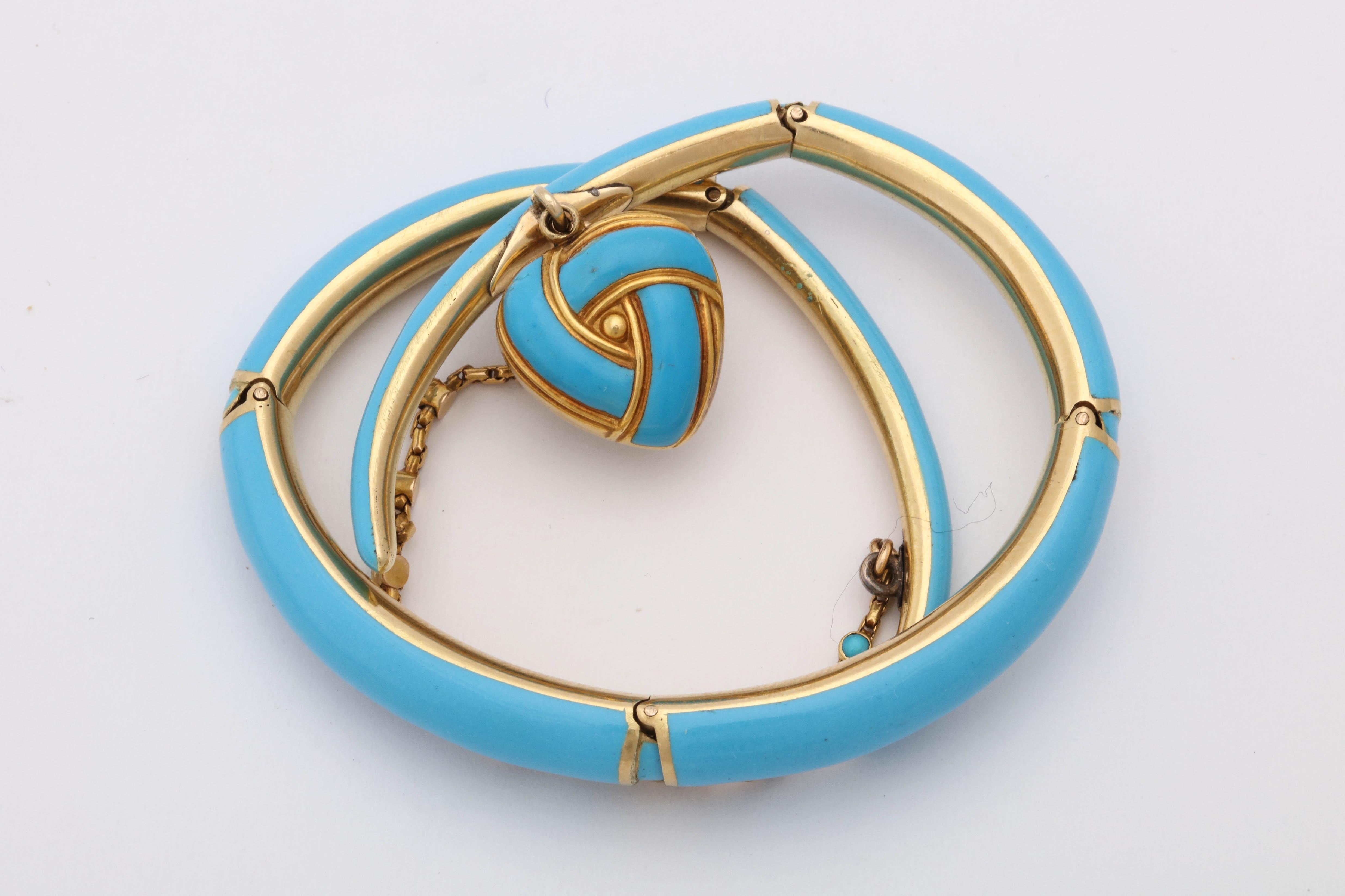 One 18kt Yellow Gold Wrap Around Bracelet Designed With Turquoise Color Blue Enamel Thruout The Bracelet. A Beautiful Handmade Heart Locket Is Dangling From The Front Of Bracelet With A Natural Pearl In The Center Of It. The Delicate Safety Chain Is