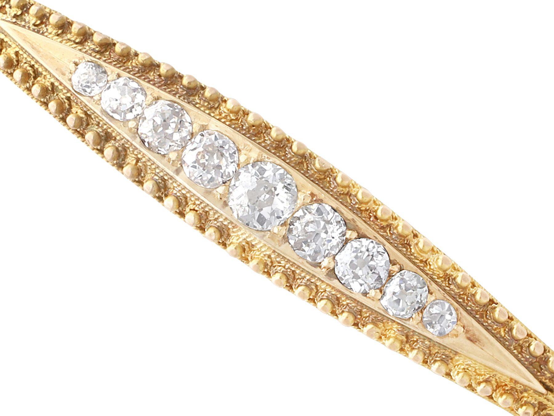 A fine and impressive antique Victorian 1.22 carat diamond and 15 karat yellow gold bangle; part of our diverse antique jewelry and estate jewelry collections.

This fine and impressive Victorian diamond bangle has been crafted in 15k yellow gold.