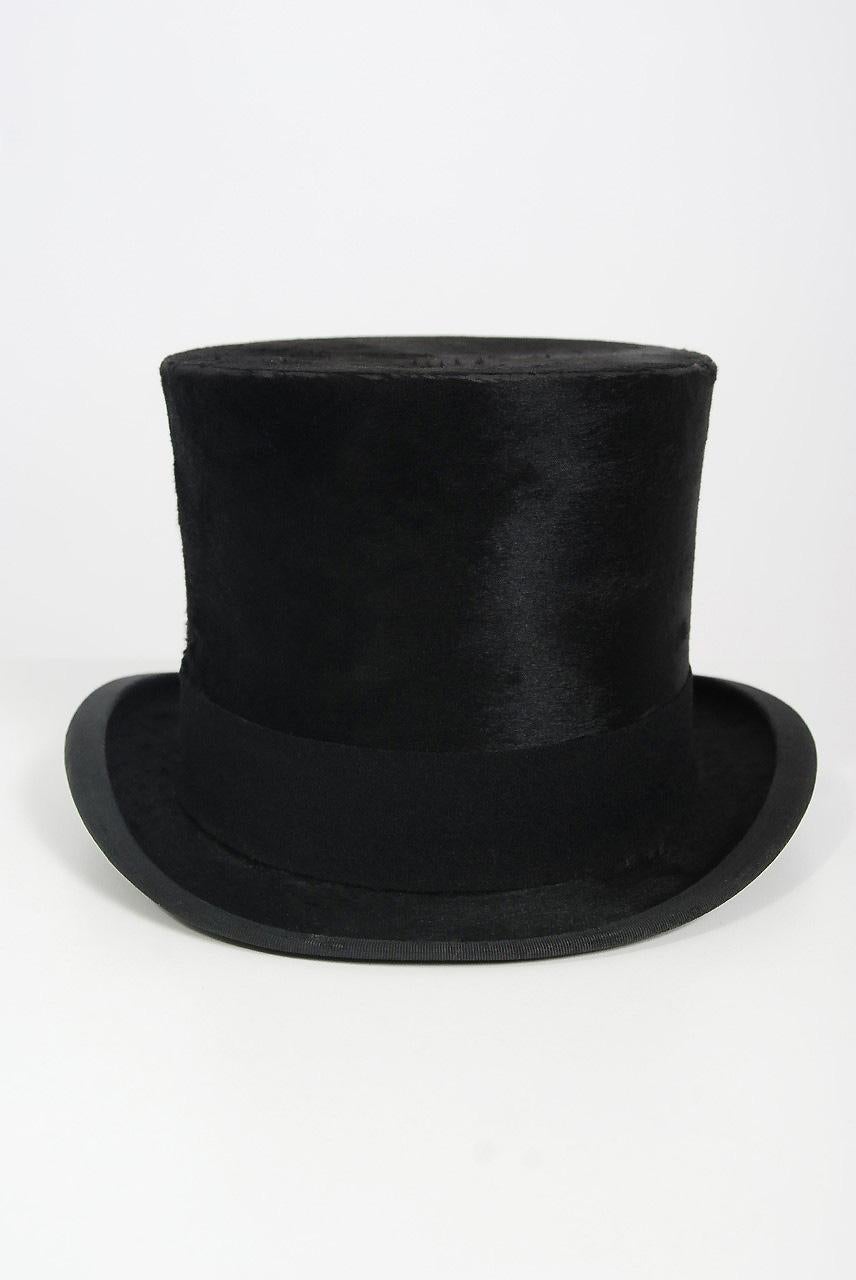 Gorgeous black silk plush original top hat dating back to the date 1890's. Dunn & Co. was founded in 1887 by George Arthur Dunn, who started by selling hats on the streets of Birmingham. Years later he had two hundred hat shops and as many