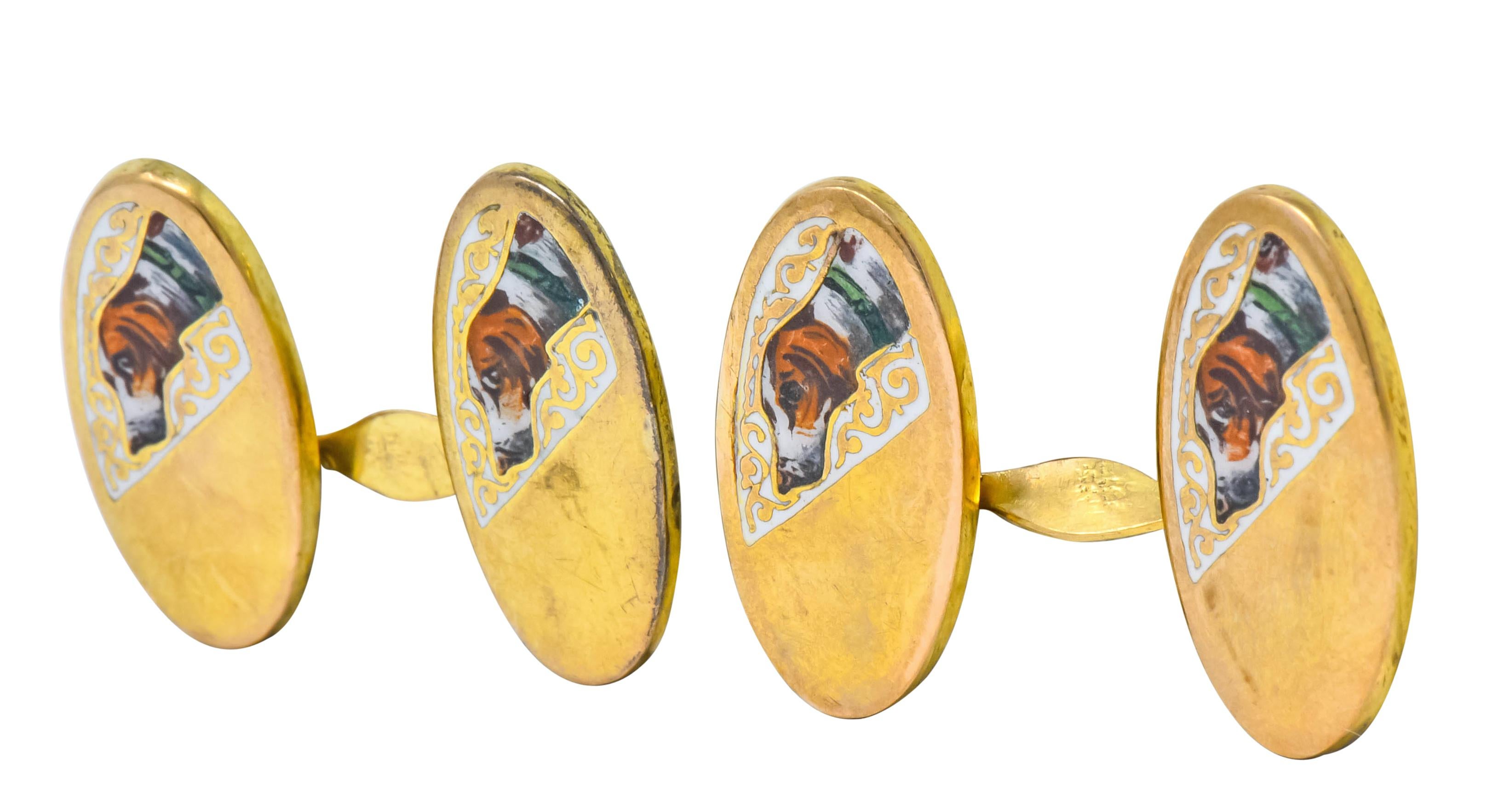 Twisted link style cufflinks terminating on each end as a gold oval bisected by enamel and a polished gold finish

Enamel depicts a finely detailed beagle dog against a white enamel background with a scrolling gold design

With some loss, consistent