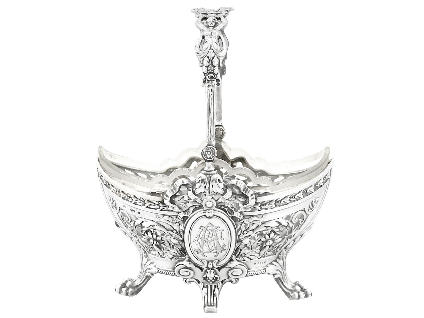 An exceptional, fine and impressive antique Victorian English sterling silver bon bon basket; an addition to our silverware collection.

This exceptional antique Victorian sterling silver basket has an oval, navette shaped form to four